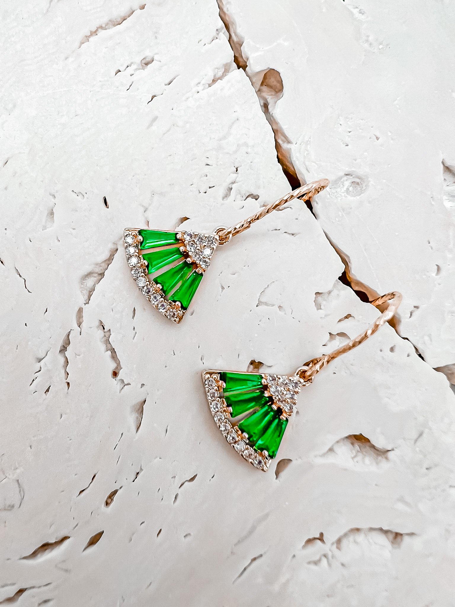 The Frida earrings are elegant and delicate. Green and white moissanite stones make up the fan motif. These beautiful earrings are crafted in 18 karat yellow gold vermeil