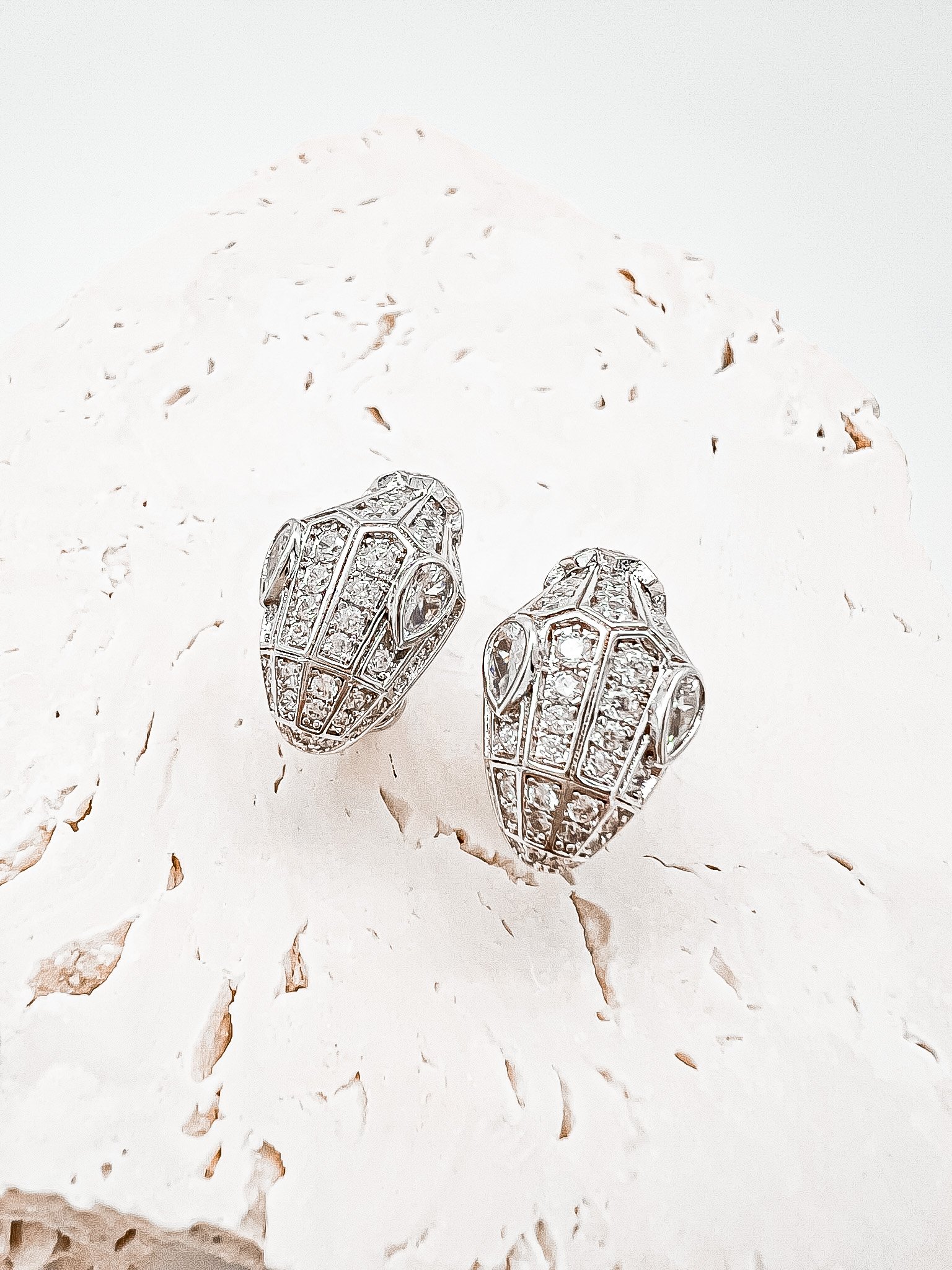 The Romy earrings are crated from moissanite stones with a serpents face. Crafted in 18k solid white gold.