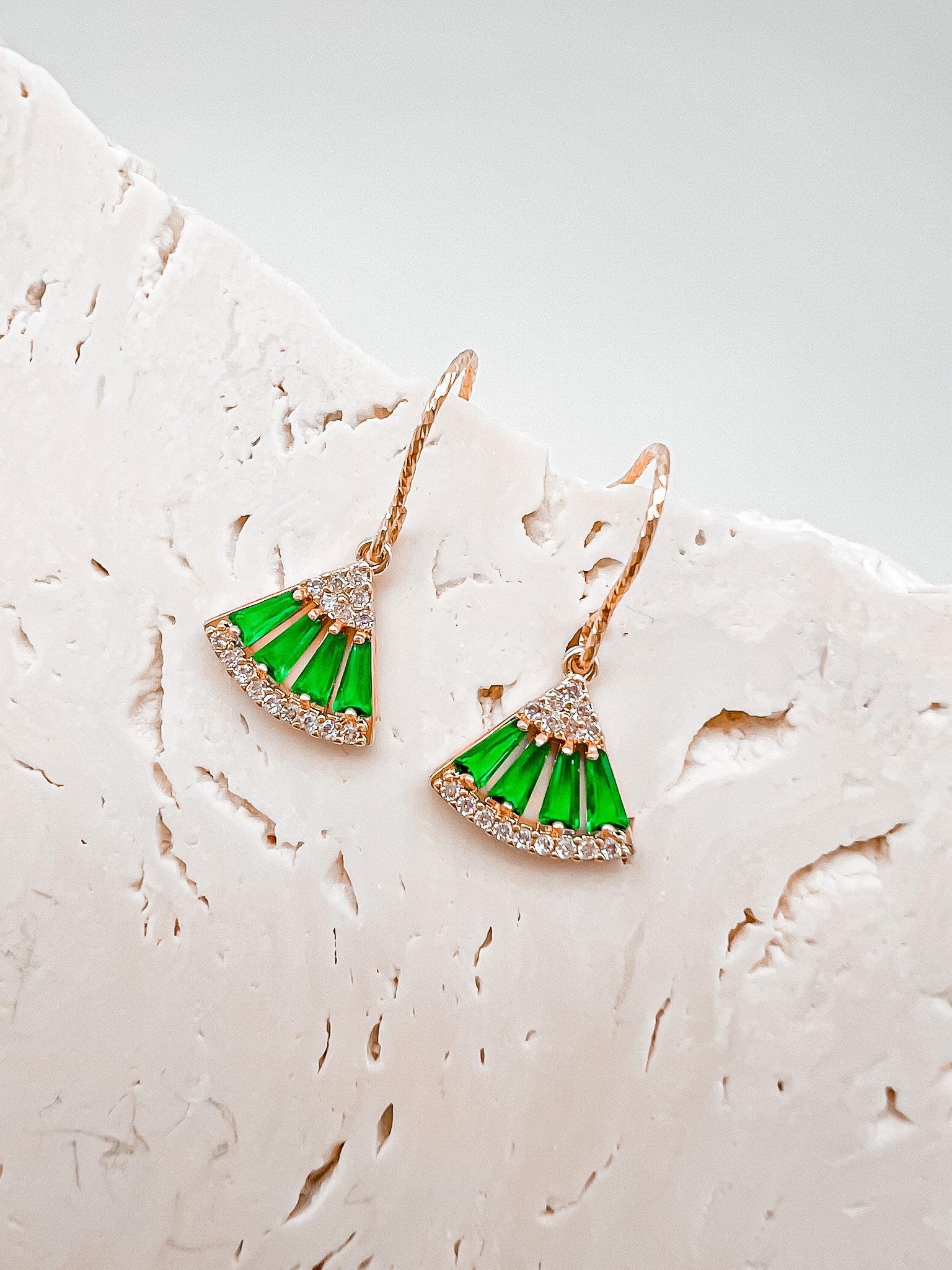 The Frida earrings are elegant and delicate. Green and white moissanite stones make up the fan motif. These beautiful earrings are crafted in 18 karat yellow gold vermeil