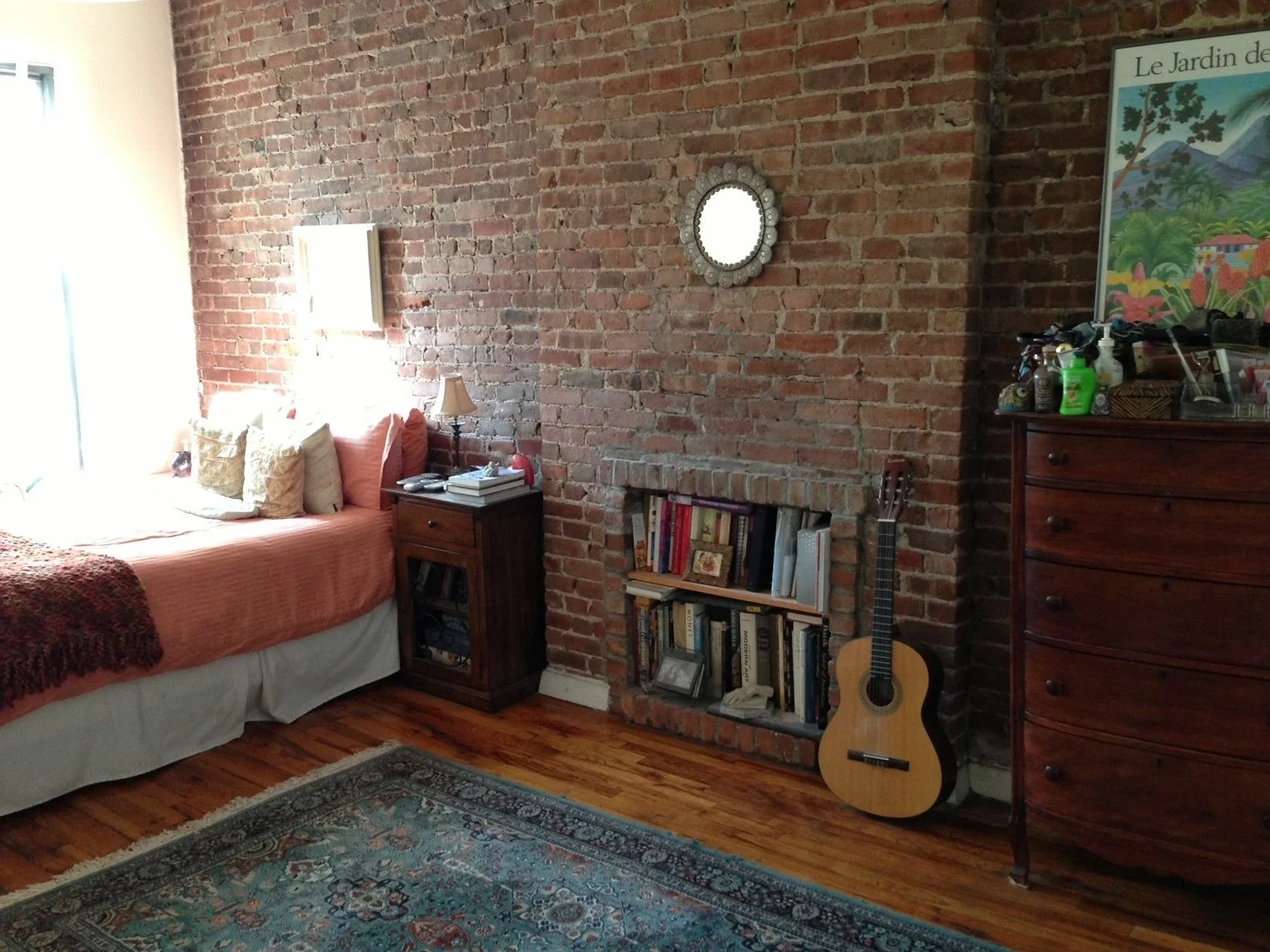 A non-working fireplace is the perfect place for a bookcase. 