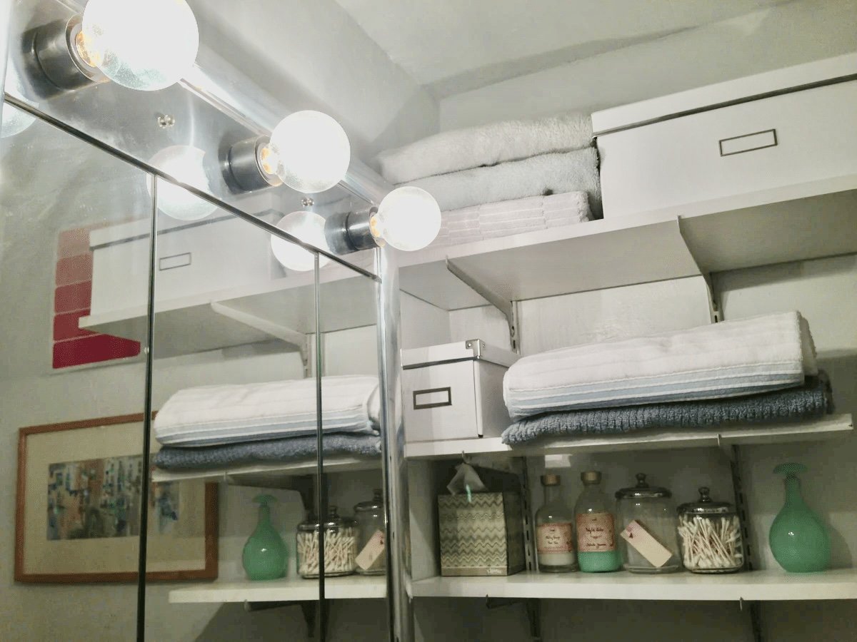 With a little bit of creativity, a tiny bathroom can hold stylish storage solutions.