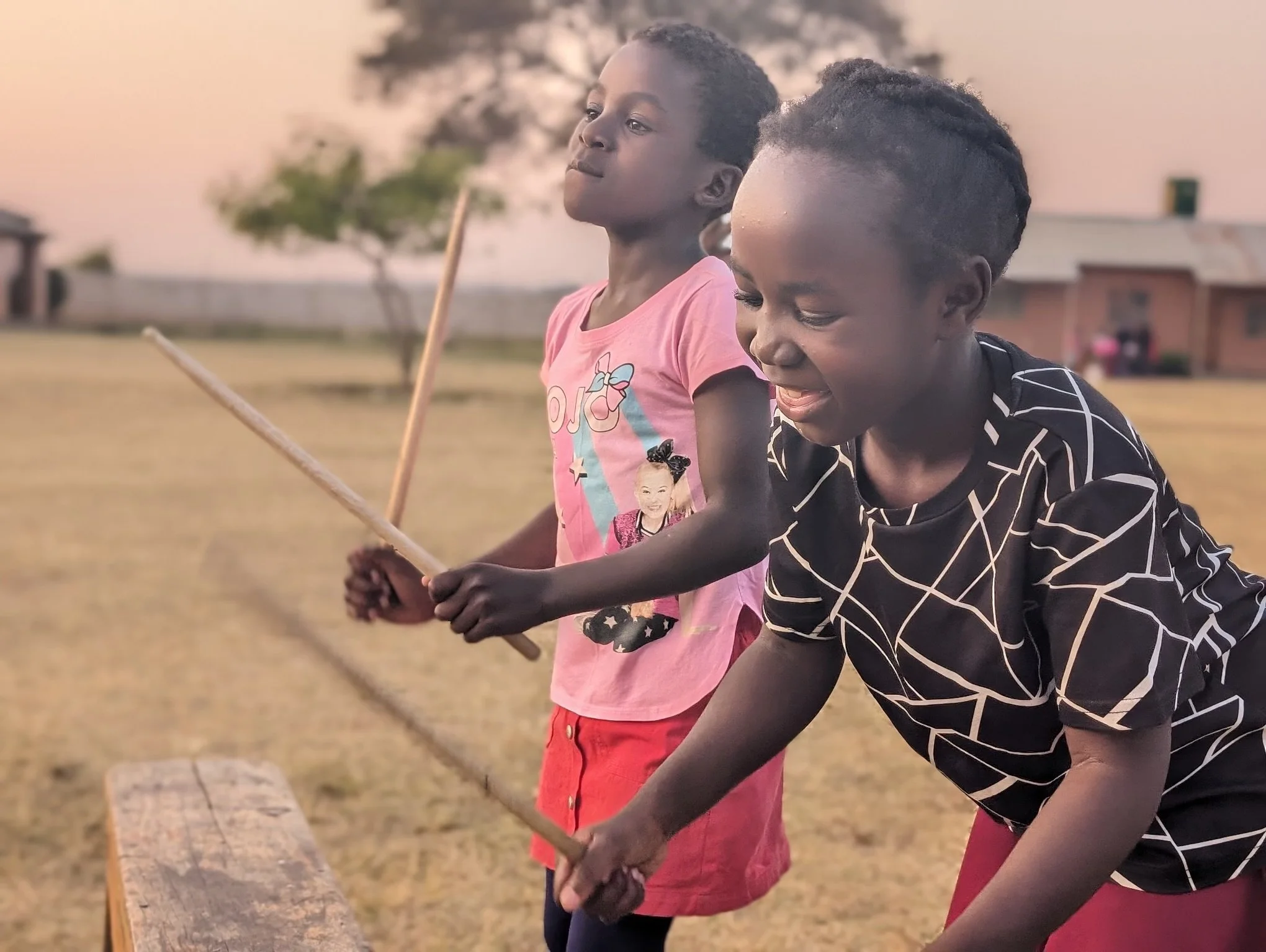 Breath of Heaven Children playing with sticks with beautiful smiles.jpg