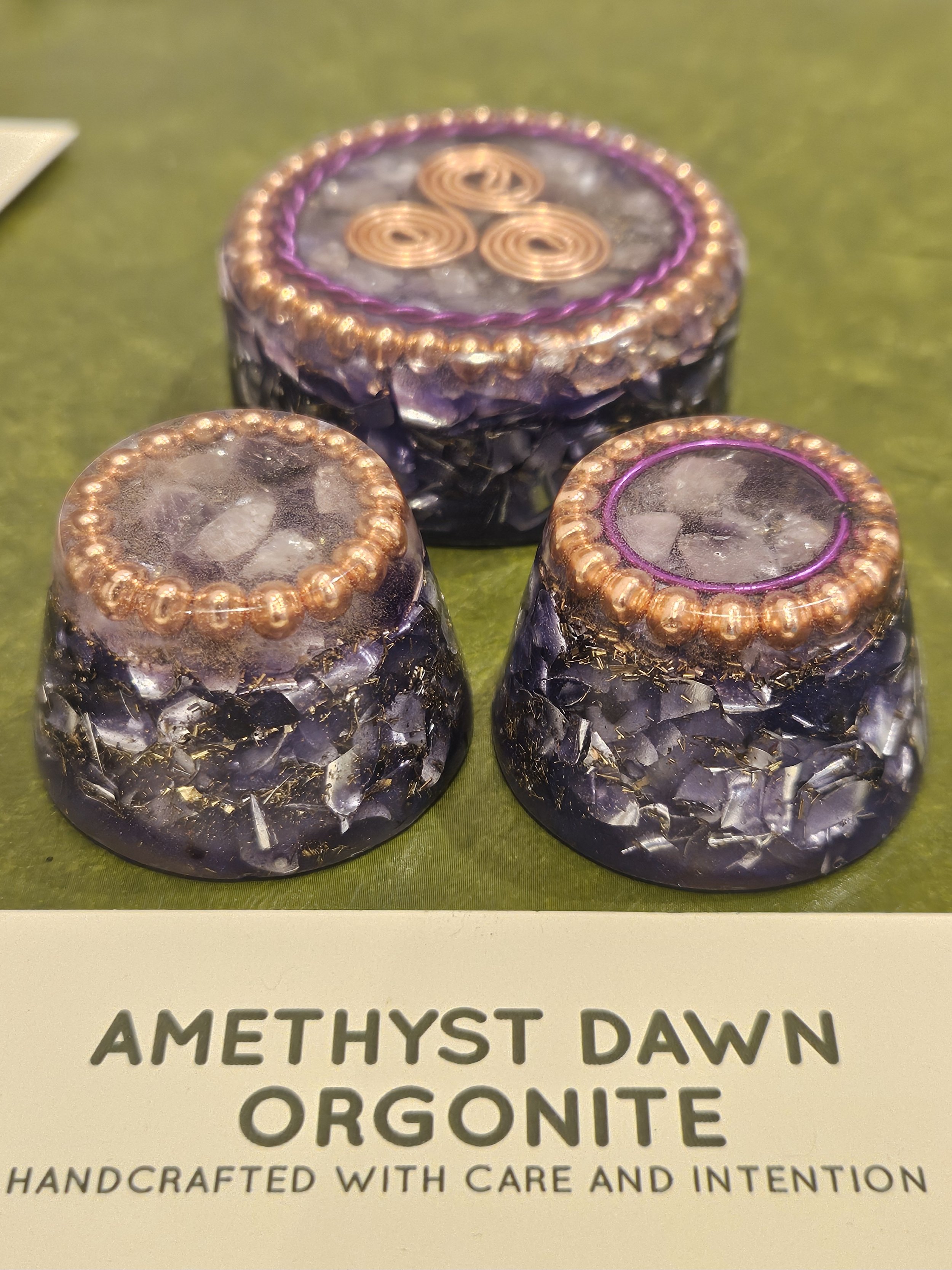 Amethyst Dawn - Table / pocket Orgonite
Price: £35  Table Orgonite
Price £25 Pocket Orgonite
Element - Air

Made from: Clear Quartz Crystal, Amethyst, Rose Quartz, Hematite, Black Tourmaline, Shungite, Triskelion Spiral, and mixed swarf.

Energy feel