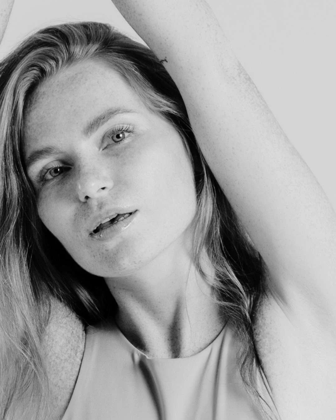 Portrait of woman with natural facial features, representing refined results after revision rhinoplasty in the UK