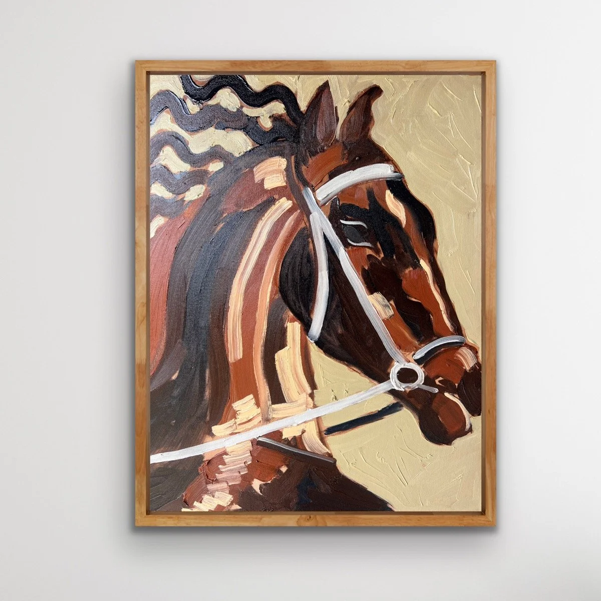 Painting of a horse's head with a beige background and a simple wooden frame.