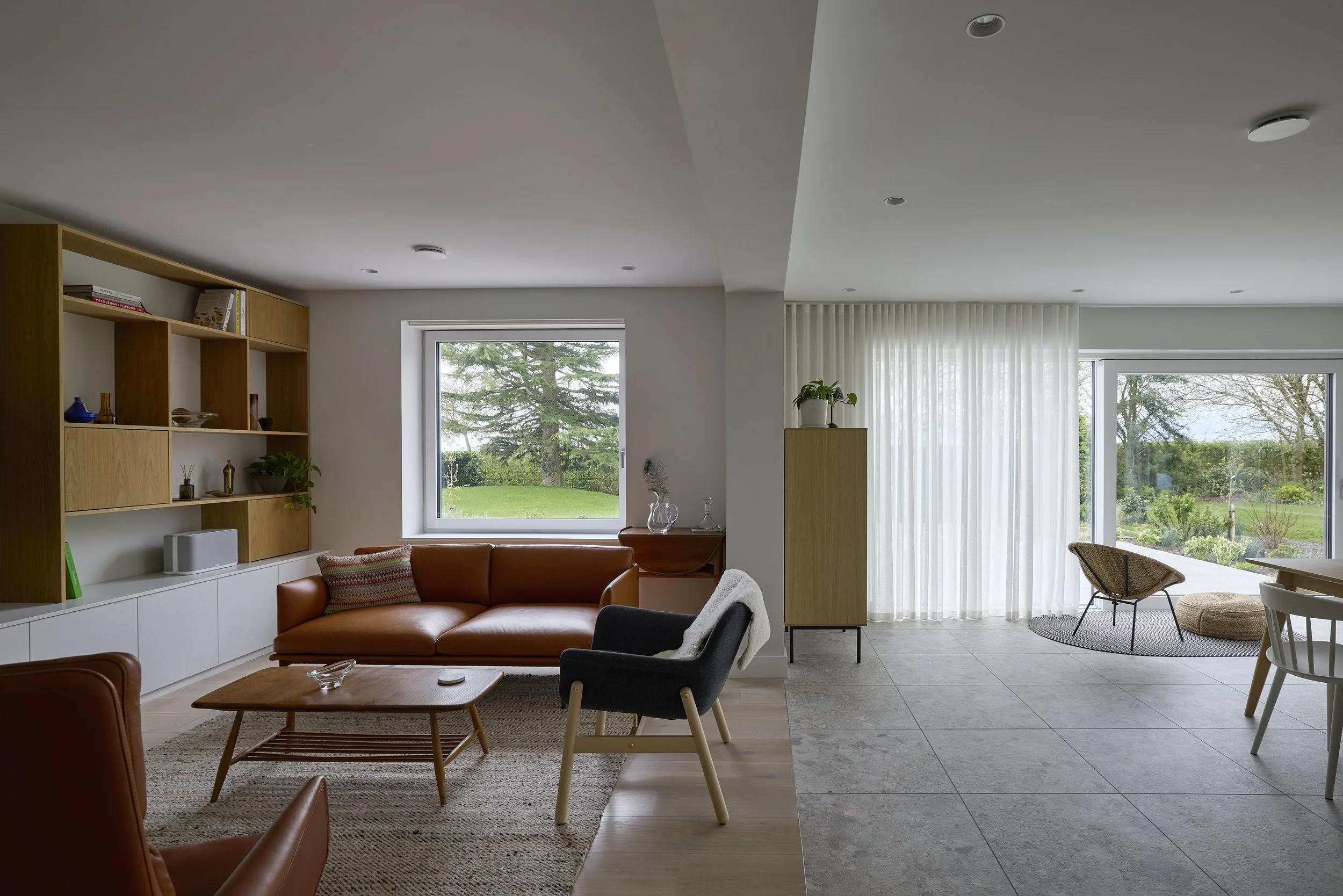 Open-plan living and kitchen space redesigned to improve flow and functionality at Mill House Farm by Boyes Design