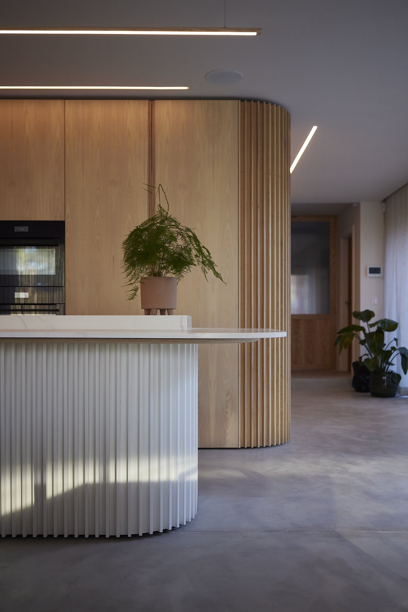 Close up of bespoke kitchen cabinetry showing oak grain and joinery detail