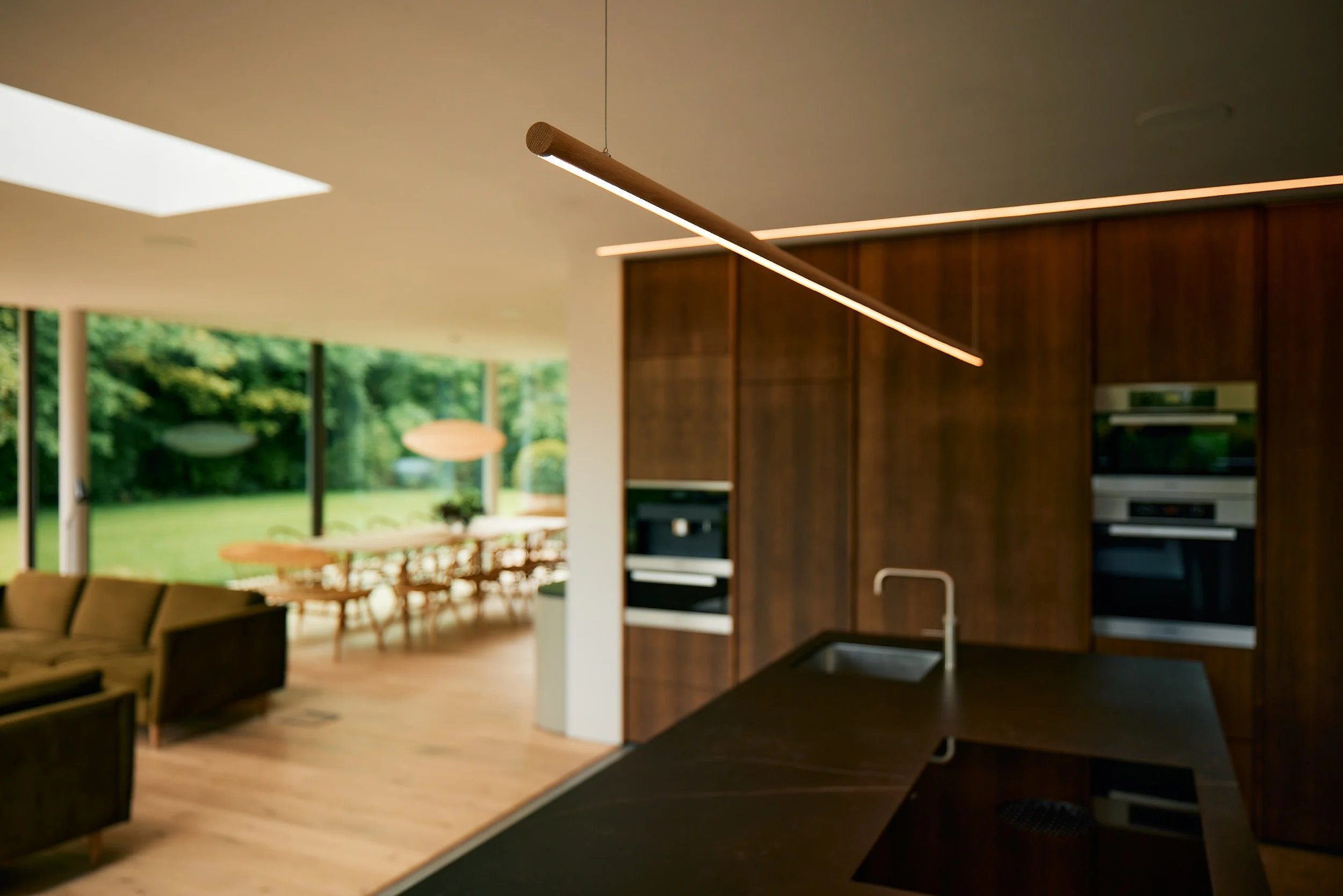 Open-plan kitchen, dining and living space at Wynstay House in Nottinghamshire, designed to maximise natural light, flow and connection between spaces.