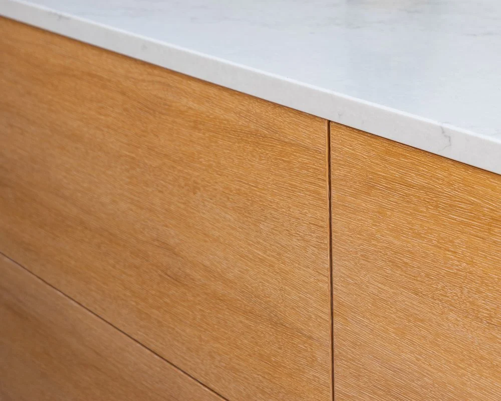 Oak kitchen drawers with integrated shadow gap detailing in bespoke joinery project West Bridgford