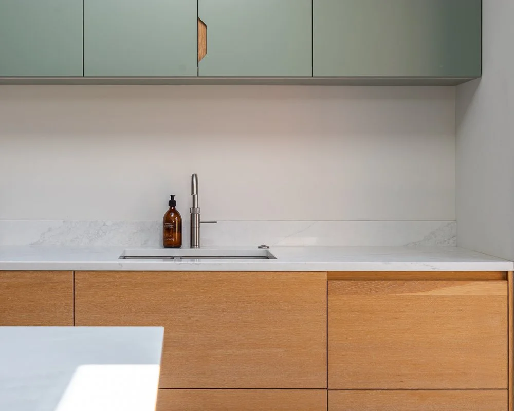 Hardwood ply bespoke joinery details in a Scandi kitchen designed and crafted by Boyes Design.