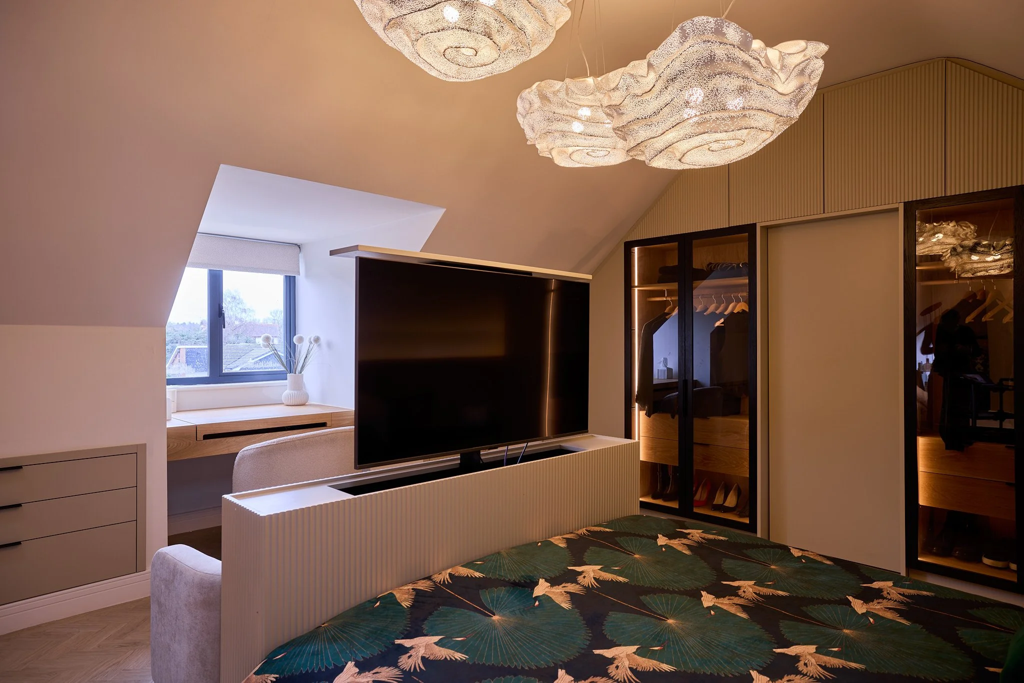 Integrated TV storage within bespoke bedroom cabinetry