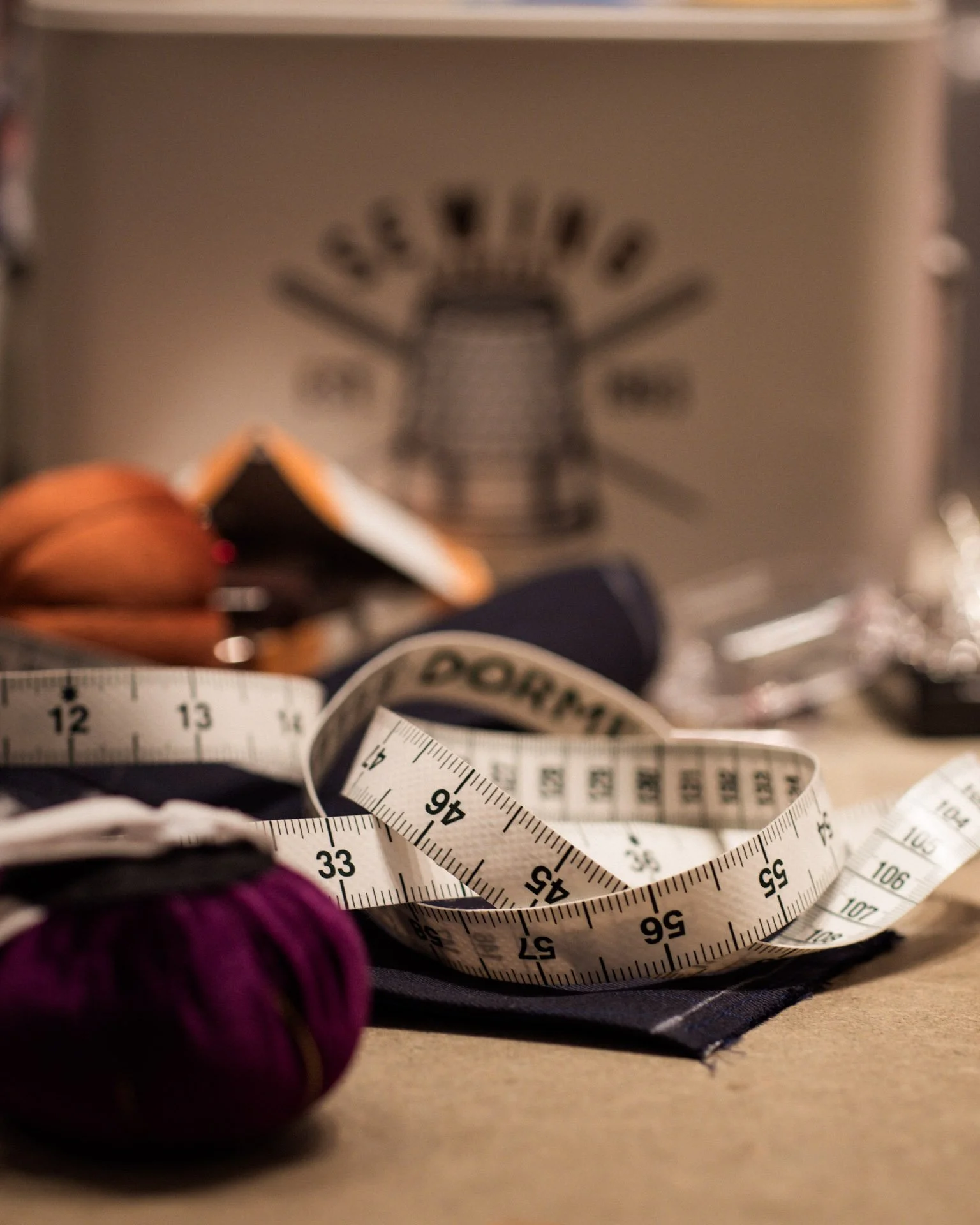 A measuring tape in the cutting room  at Knatchbull on Savile Row, London.