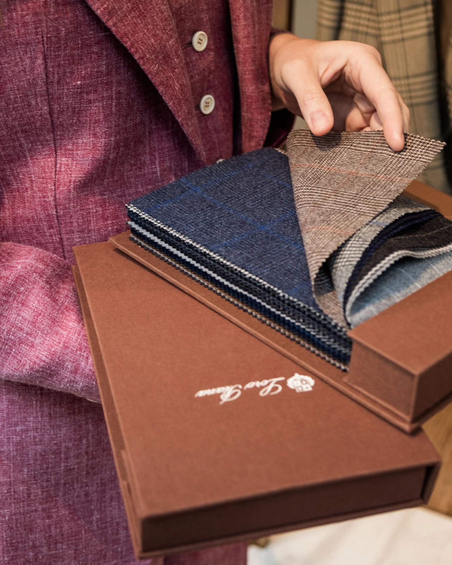 Daisy Knatchbull, founder of Knatchbull, going through fabric samples.