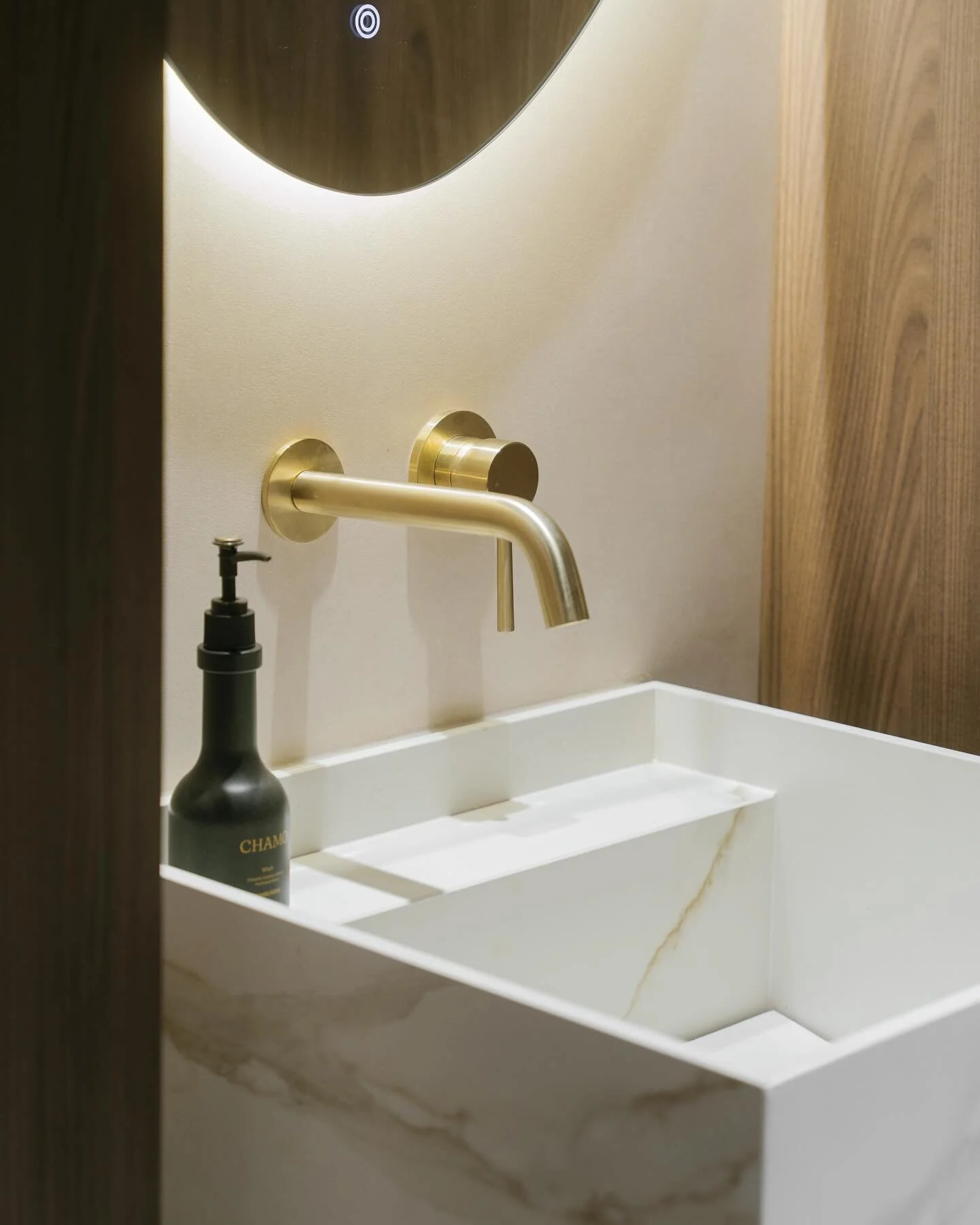 Accented with the colour of Saege, our shower feature wall is a display of tiling perfection with a one of a kind slanted niche. By the vanity area, streaked with bold grey veins, awaits a beautifully crafted pedestal sink.
——— Say