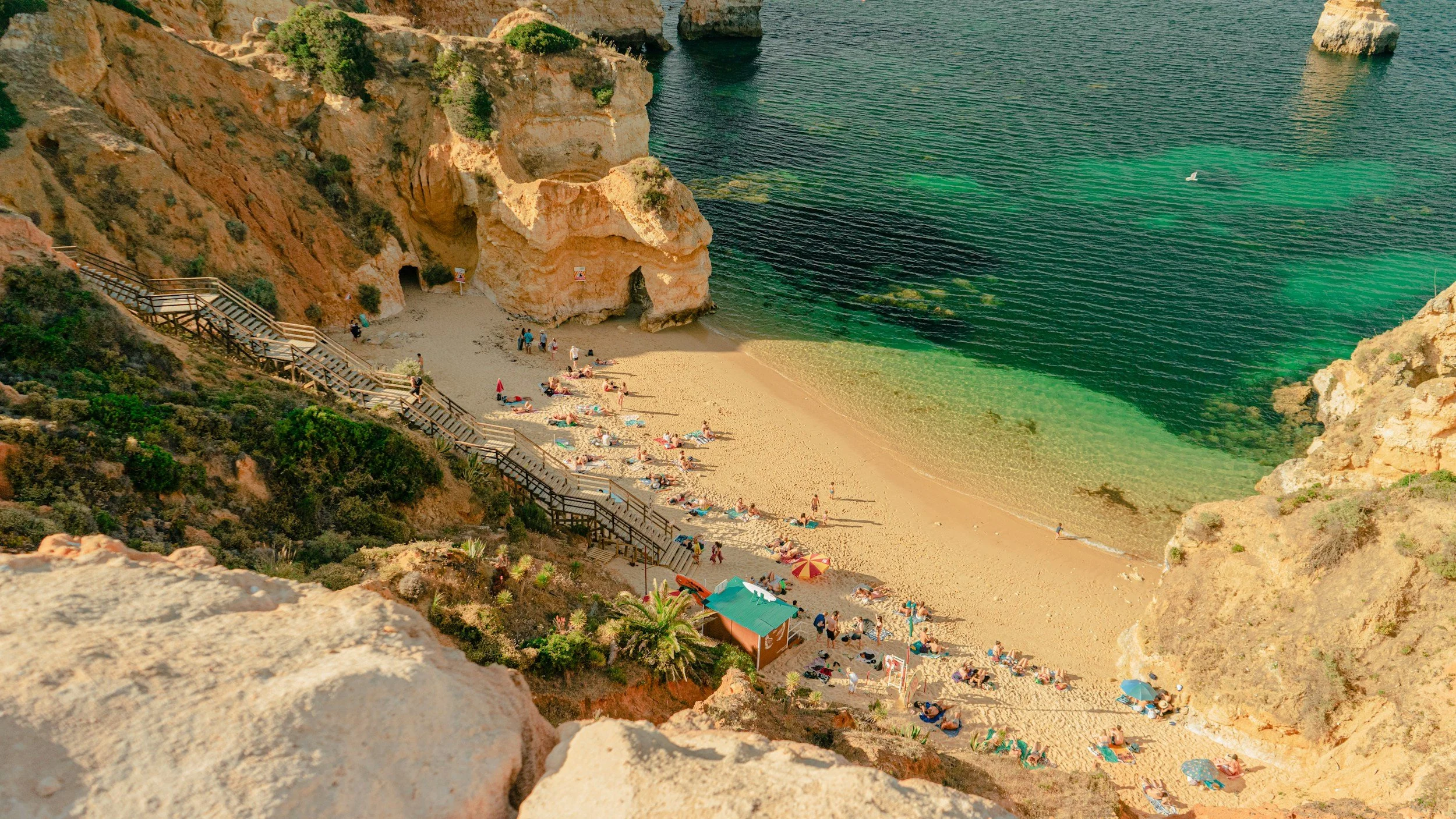 a small beach in the algarve region of portugal
