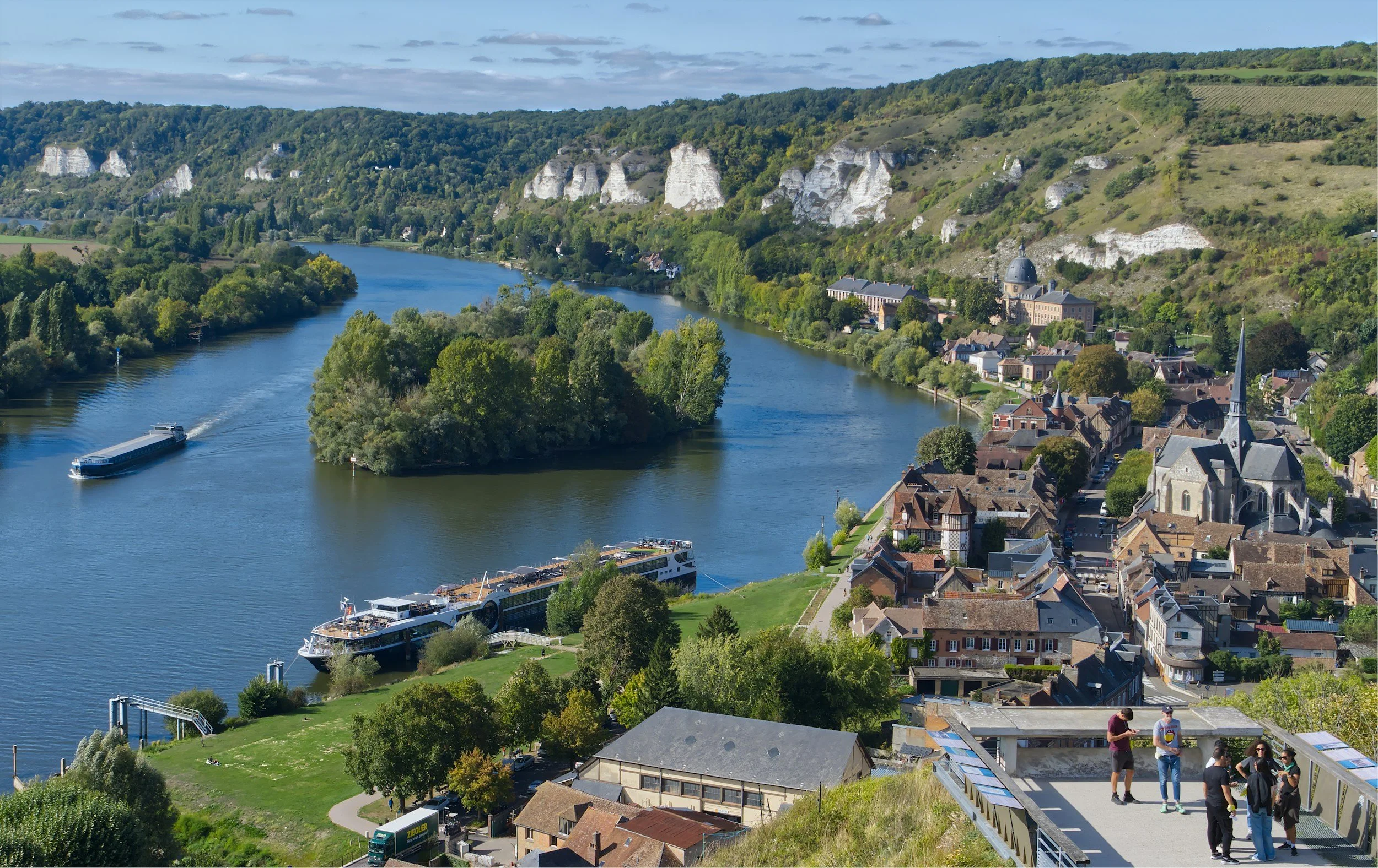 An arial view of a river cruise boat at port on the Seine in Normandy.