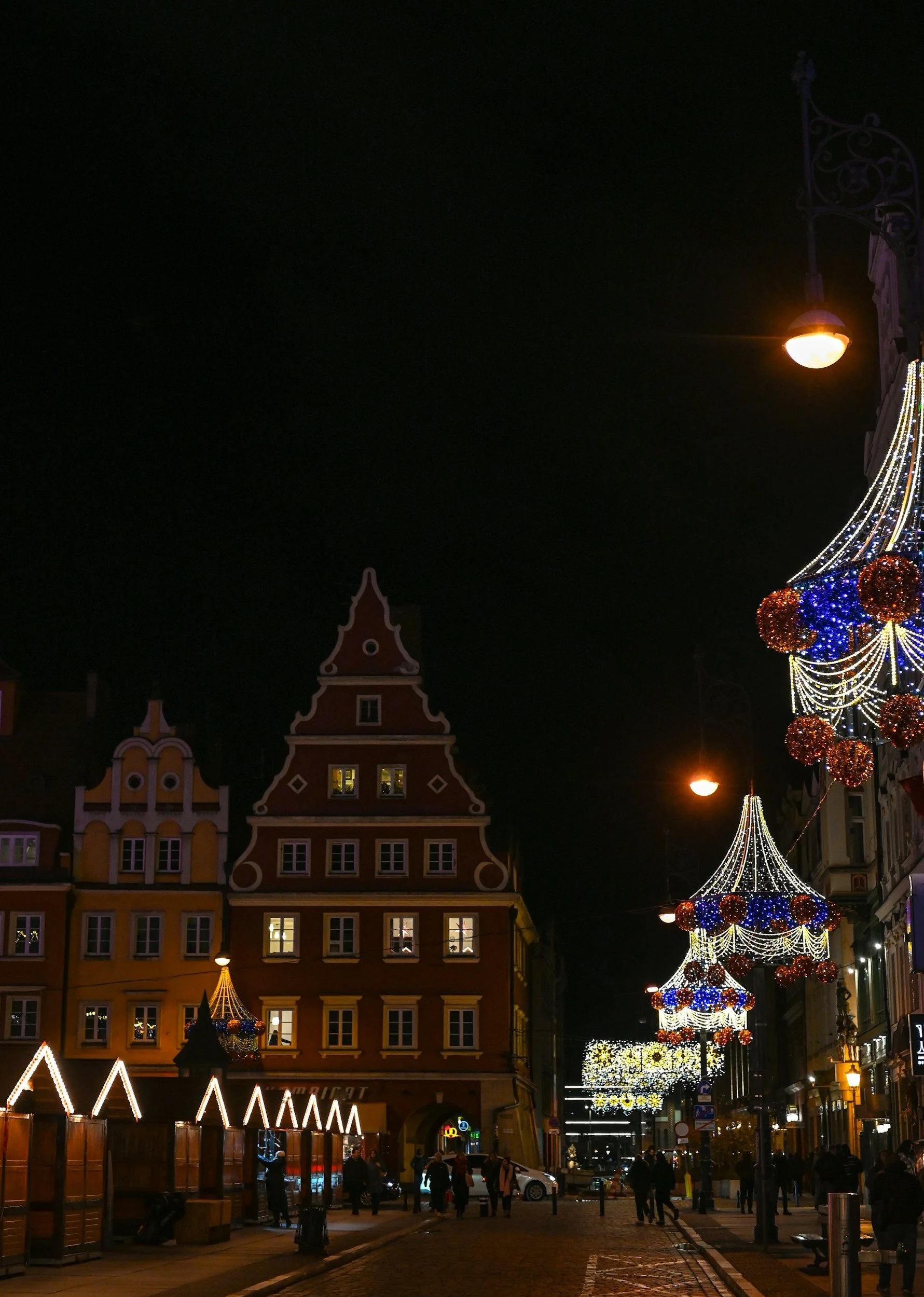 Wrocław Christmas market lit up in the Market Square at dusk, Poland