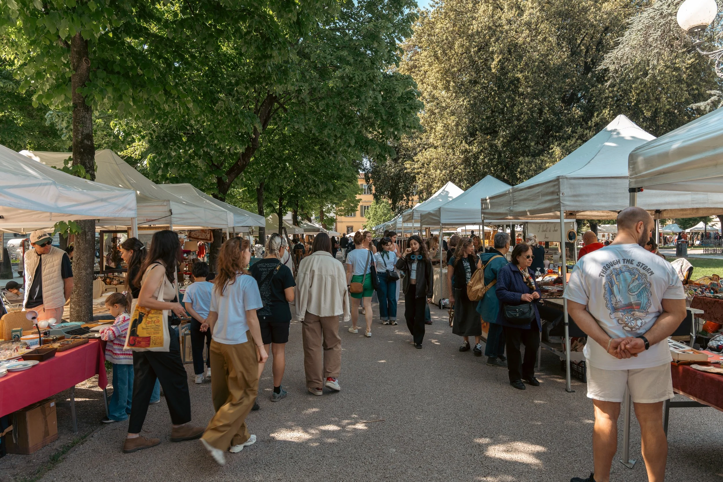 an outdoor antique market in italy