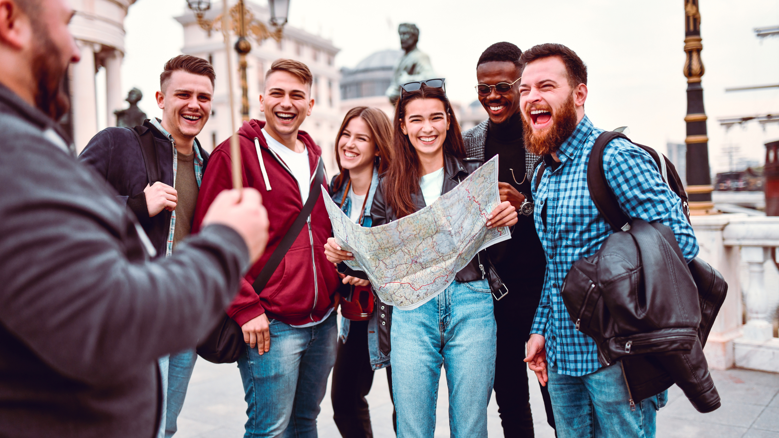 a tour group exploring a city with a map.