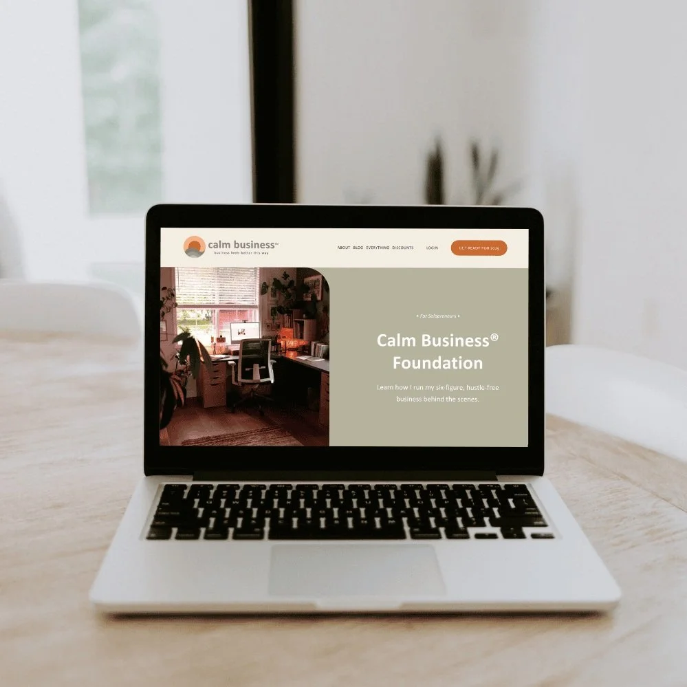 Laptop showing the sales page for the Calm Business Foundation course