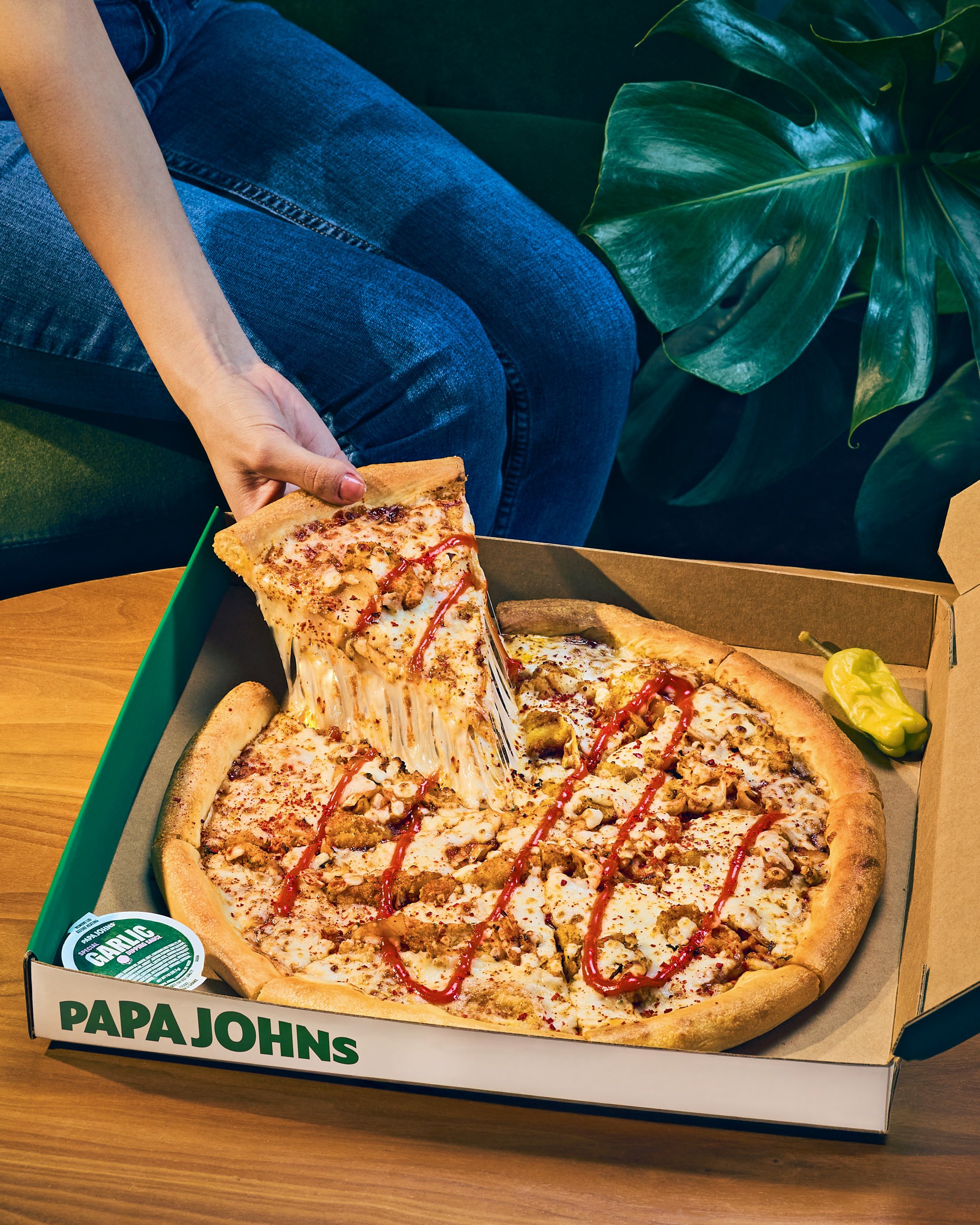Papa Johns International_Nov 2025_Korean BBQ Pizza_Pizza in box with Cheese Pull_Hand Model_0309.jpeg