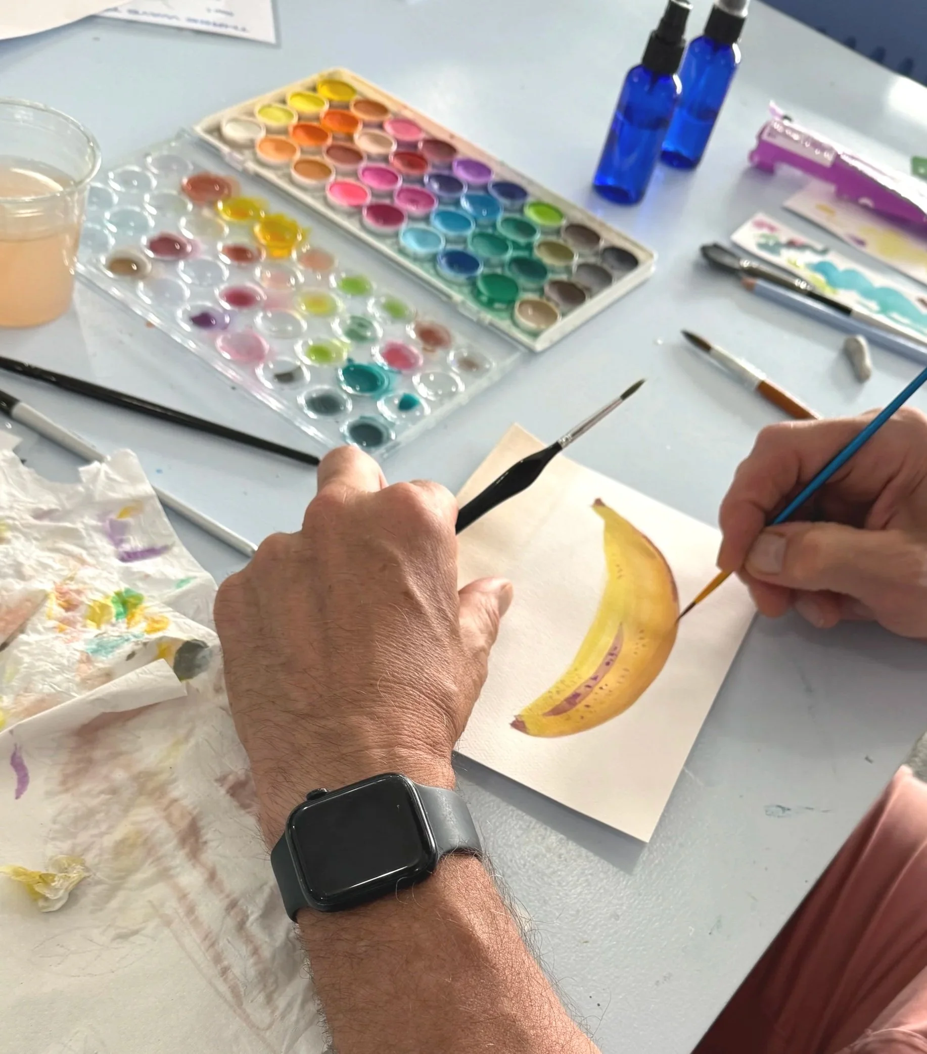 Happy customer painting a watercolor in a painting class at Three Blue Brushes Studio (Copy)