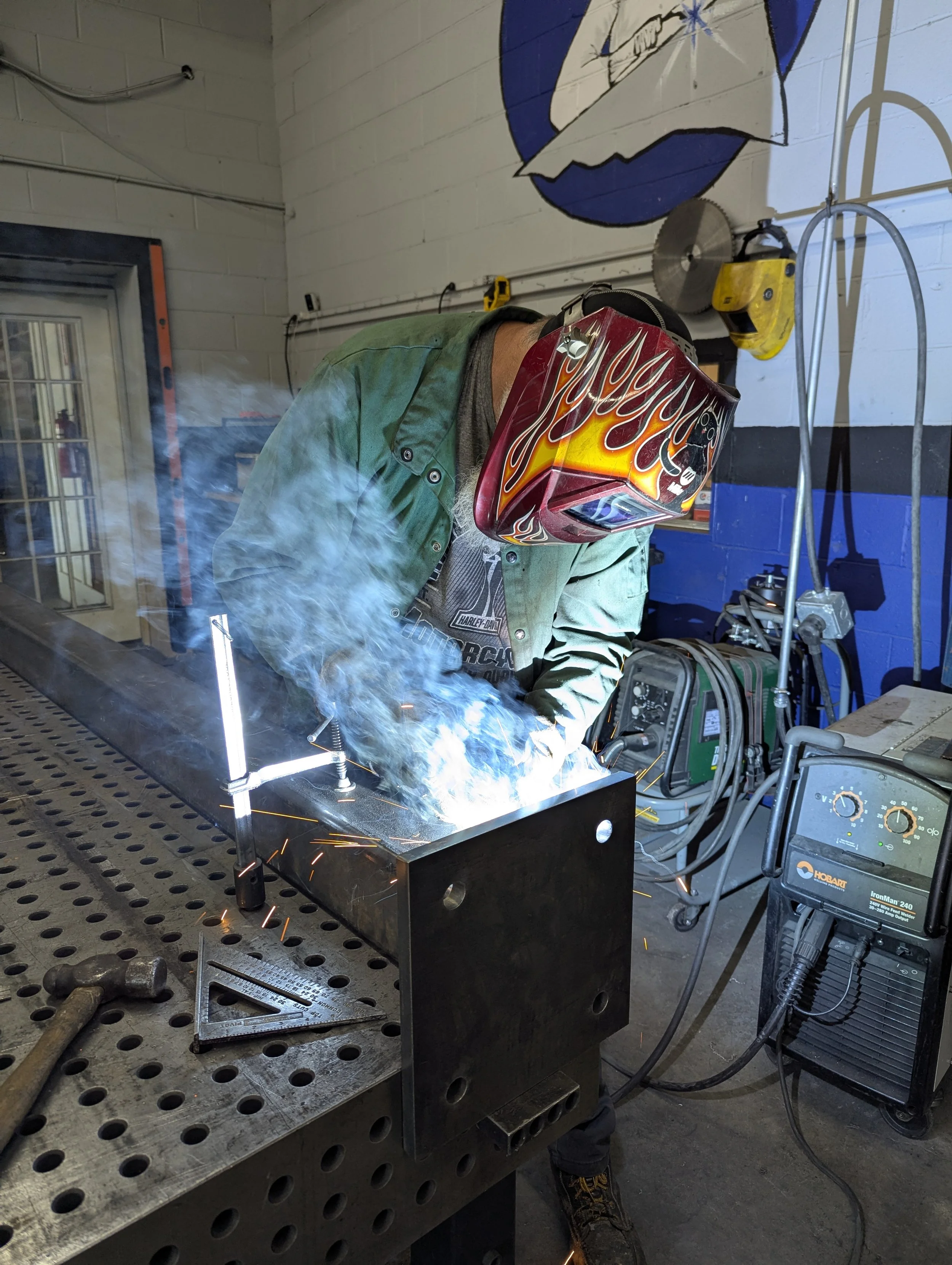 Welder at a fixture table in the Dade Fabrication shop in Trenton, GA