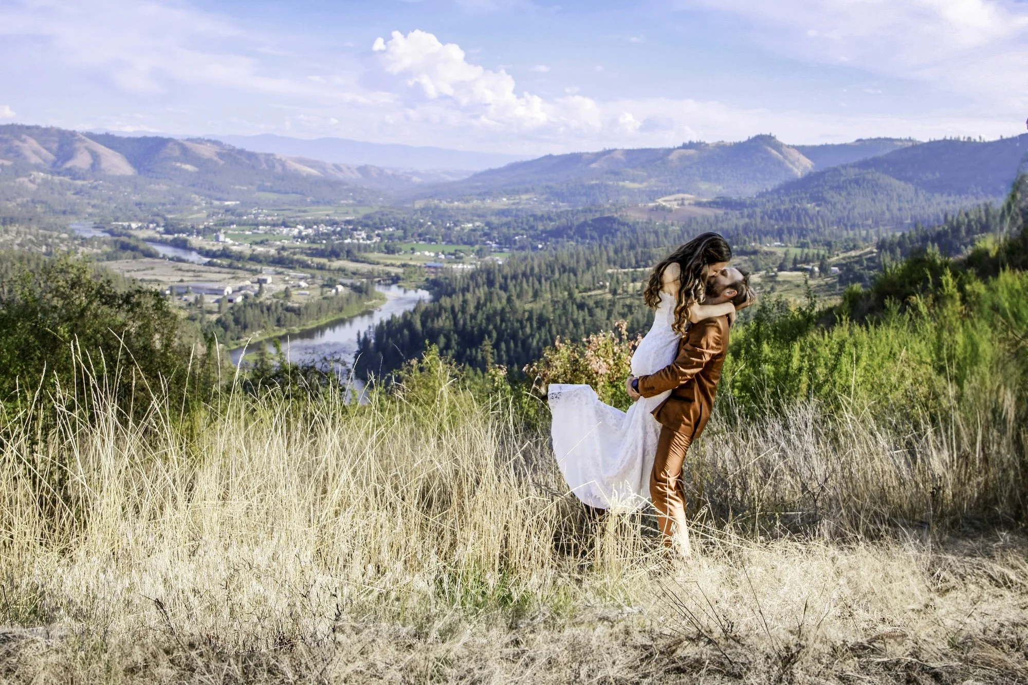 mountaintop-wedding-portrait-overlooking-valley.jpeg