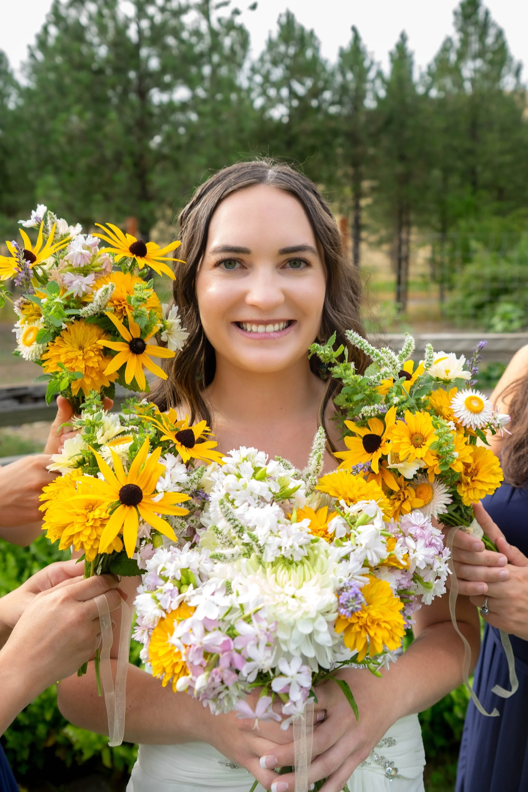 bride-holding-sunflower-bouquet.jpeg