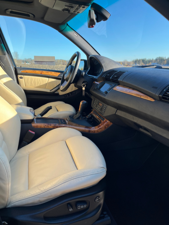 very clean car interior with beige leather seats