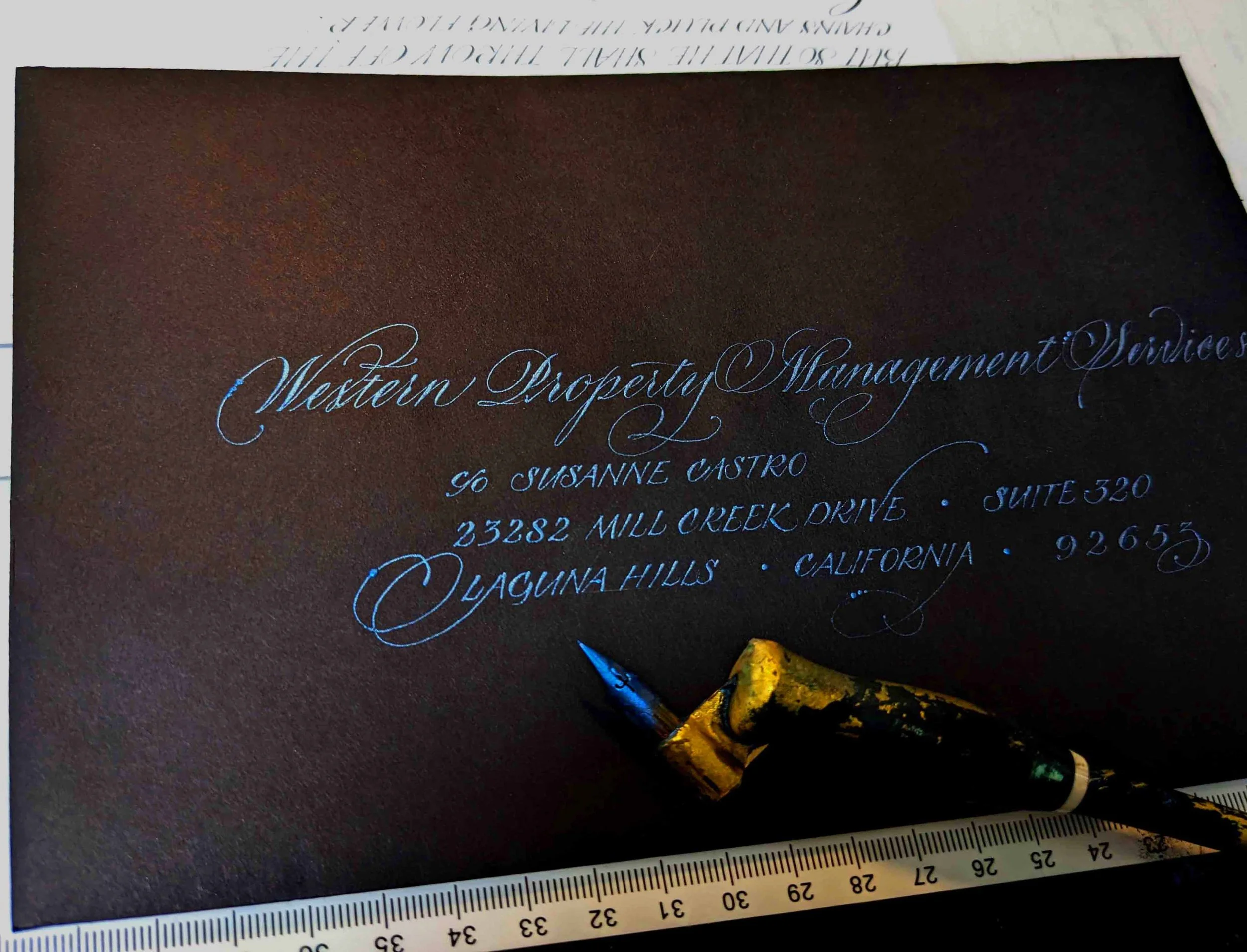 iridescent blue ink black paper copperplate script.jpg