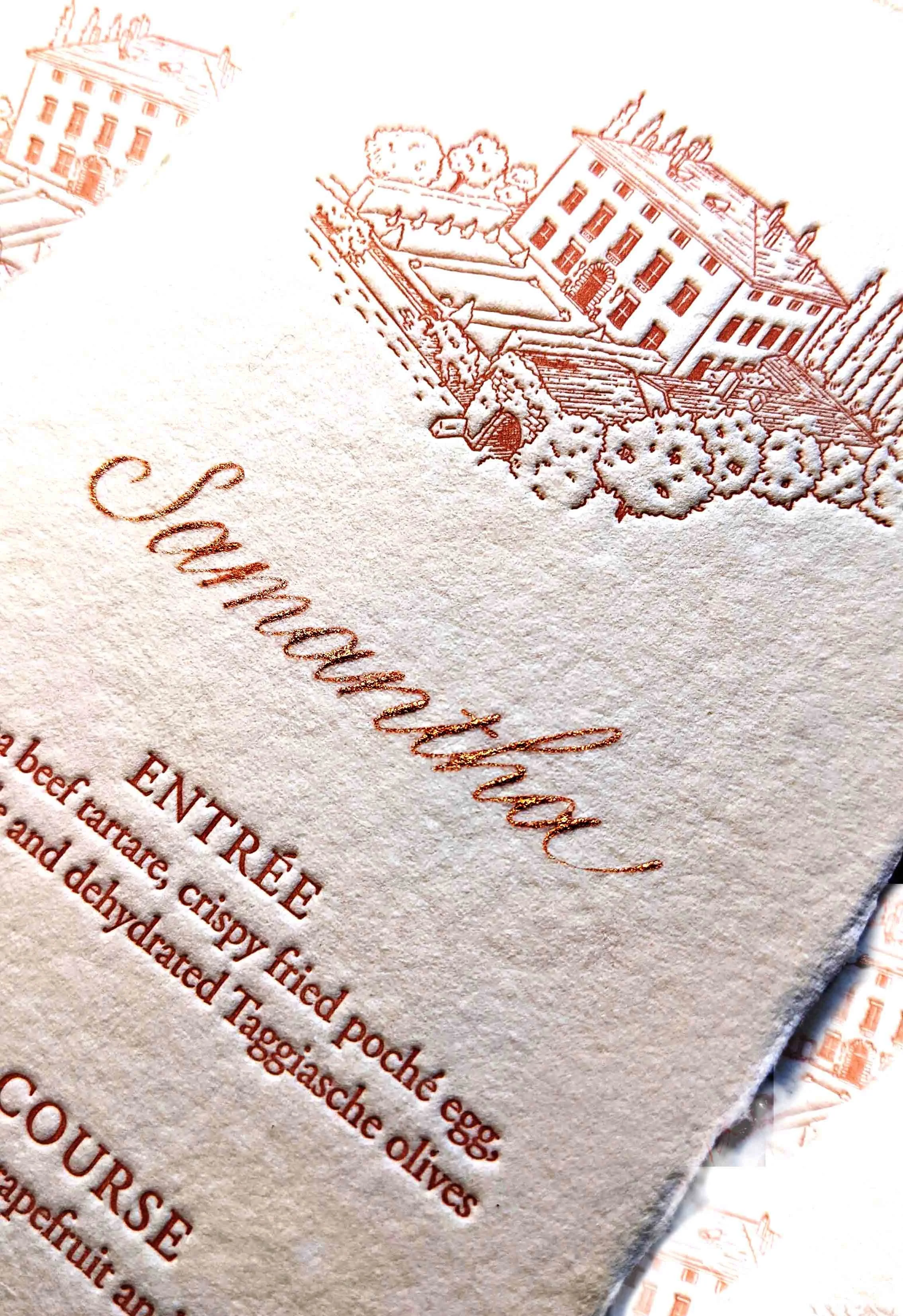 A dinner menu on handmade paper and personalized in custom matched rose gold ink.