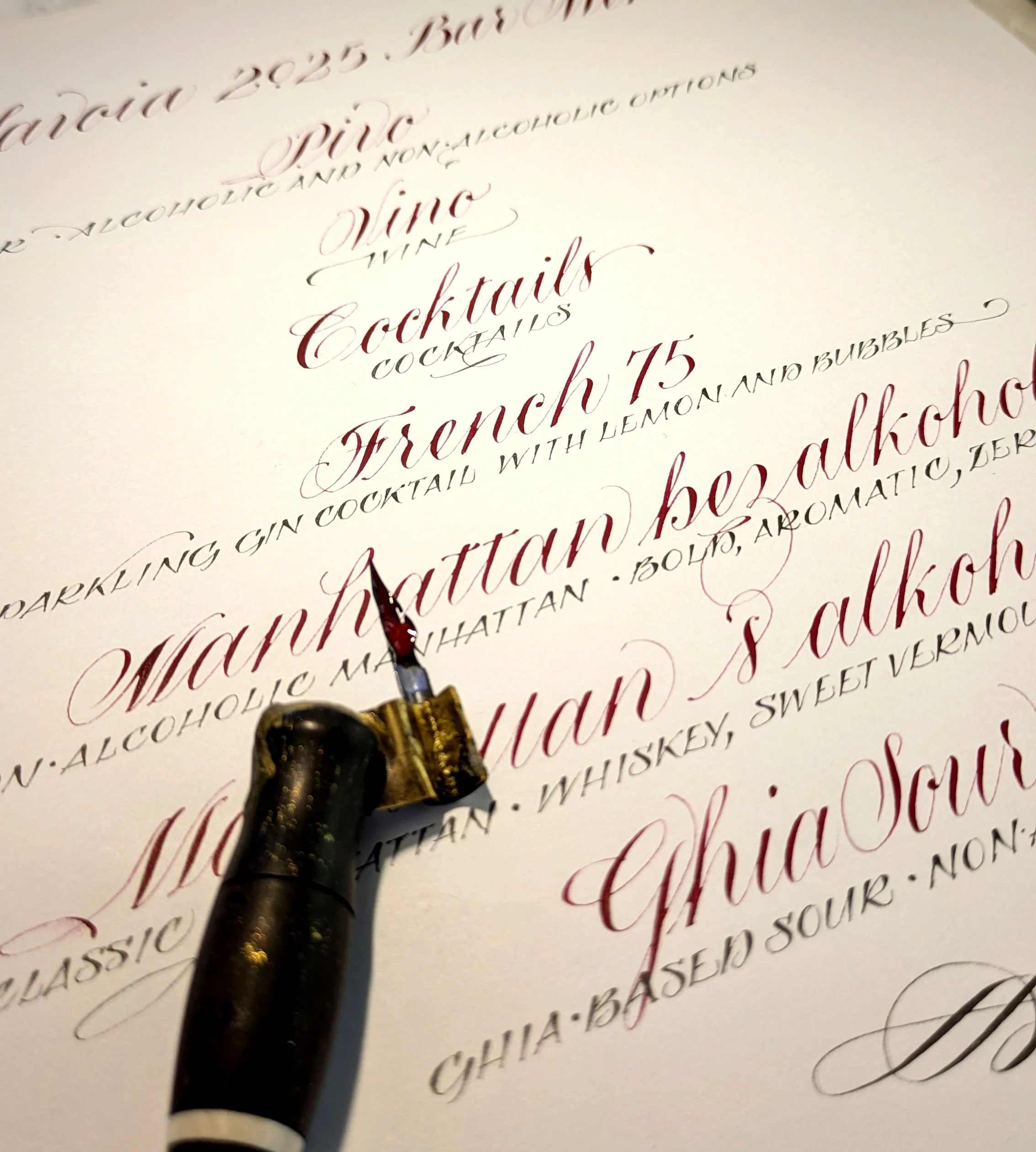 A bar menu for display. Created for a wedding  reception open bar  and lettered in calligraphy script in red and black ink.