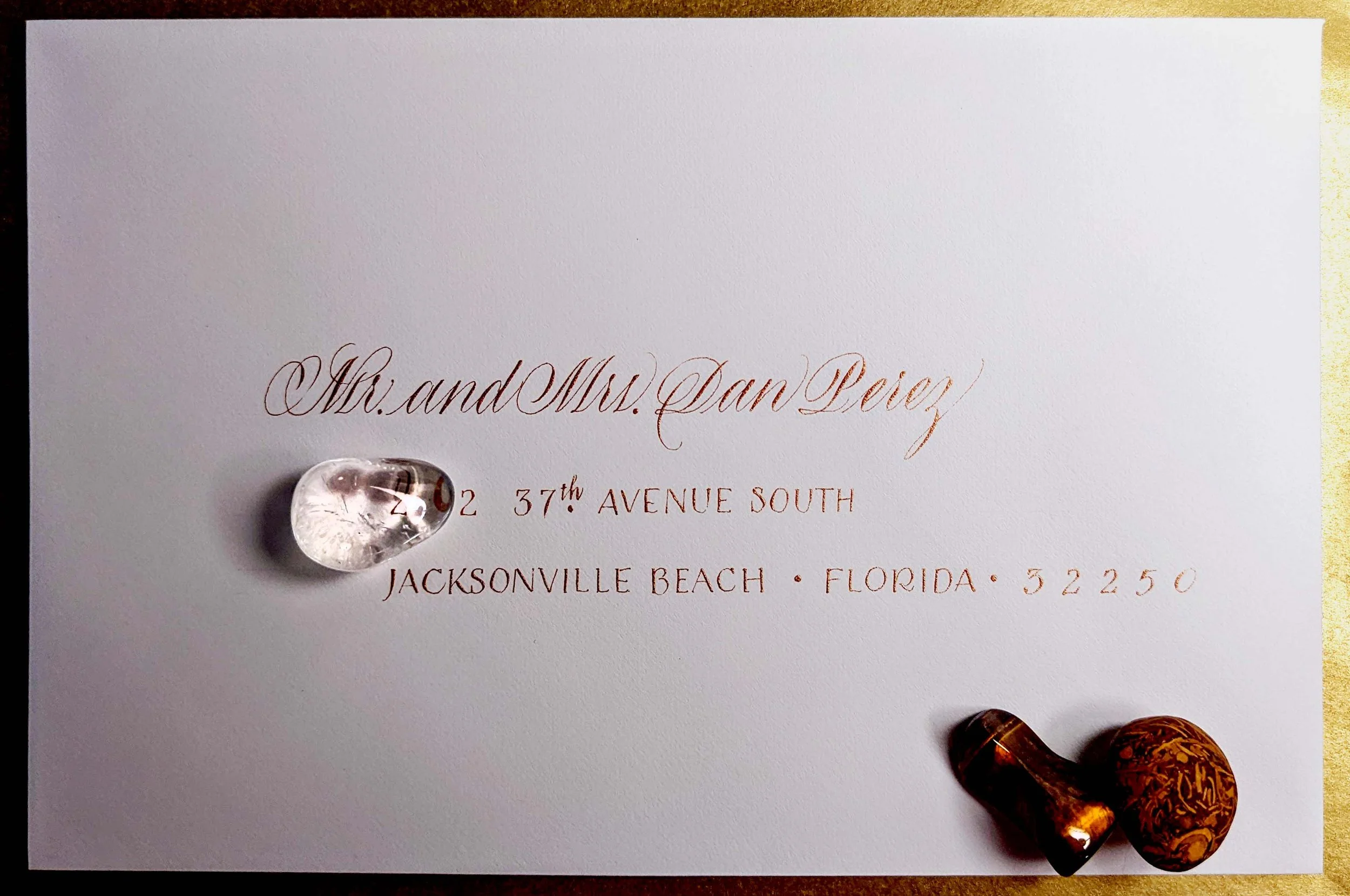 gold ink on white envelope calligraphy.jpg