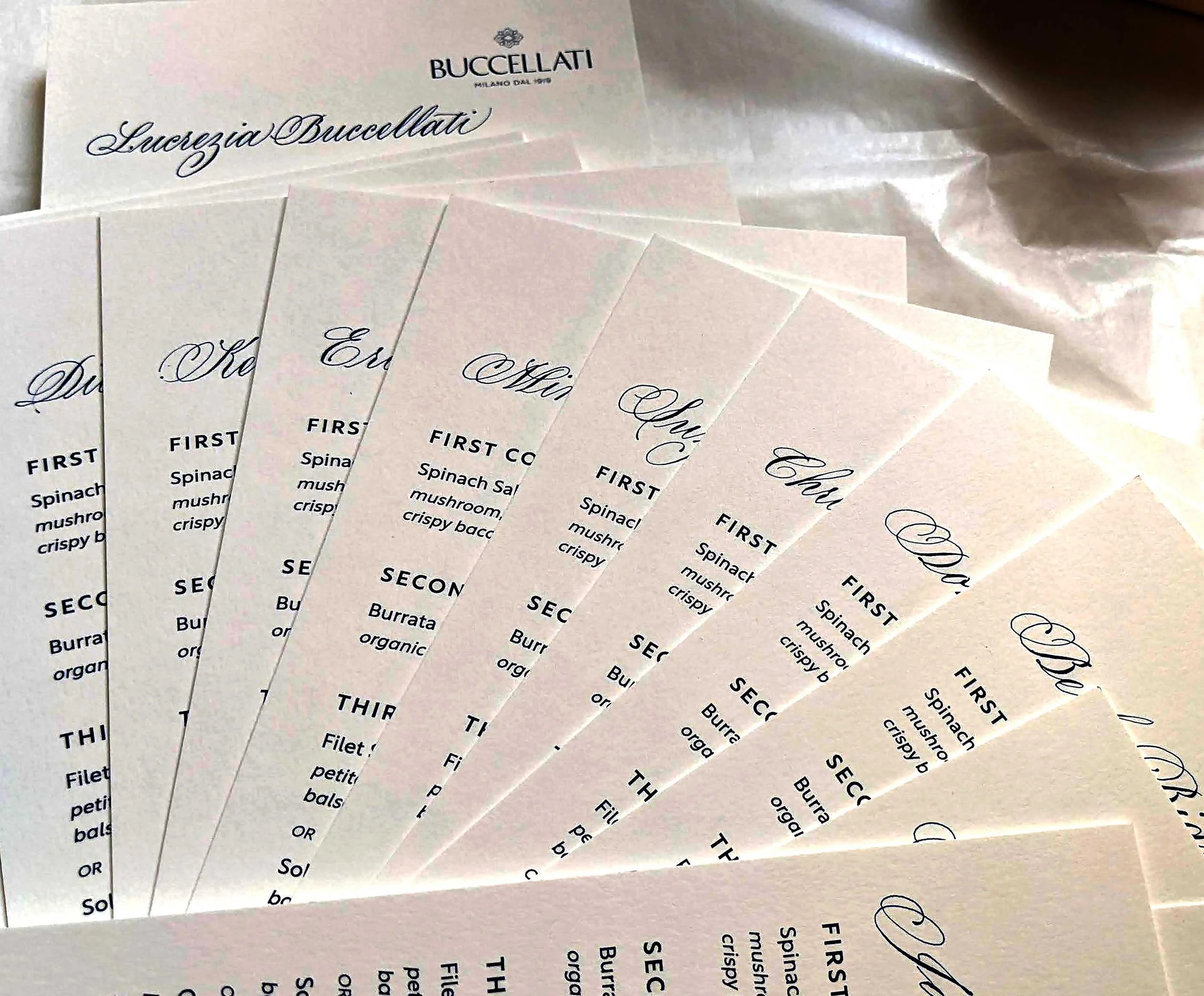 fan of dinner menus as place cards