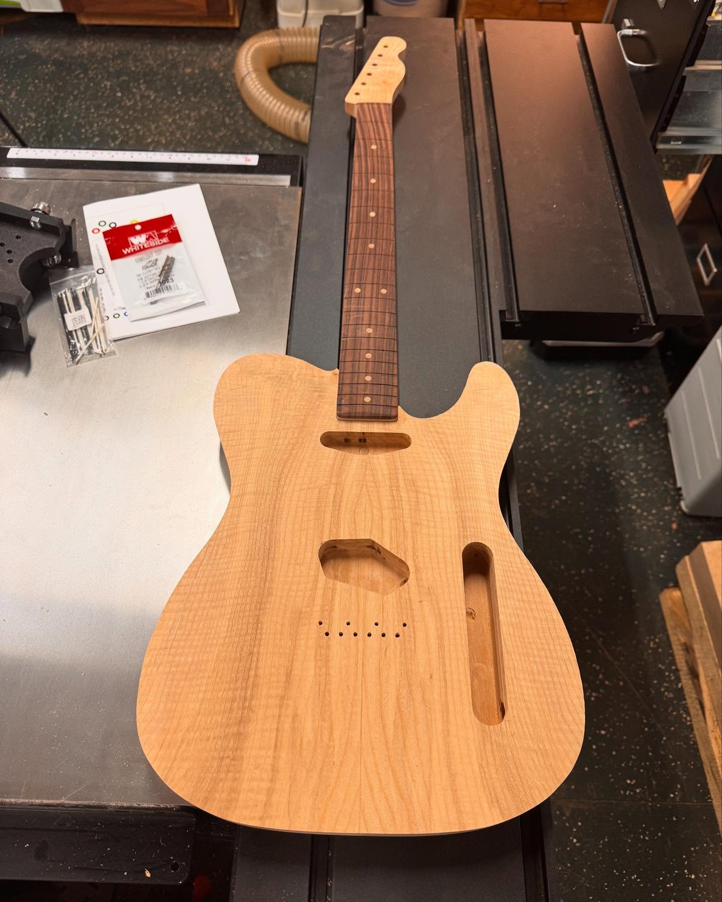 The tele is coming along. Neck is figured maple with an ebony fretboard, and I used the offcuts of the veneer top for the fretboard inlays. Get ready for a cool dye job and some sweet gold hardware ⭐️

#guitarbuilder #guitarbuilding #electricguitars 