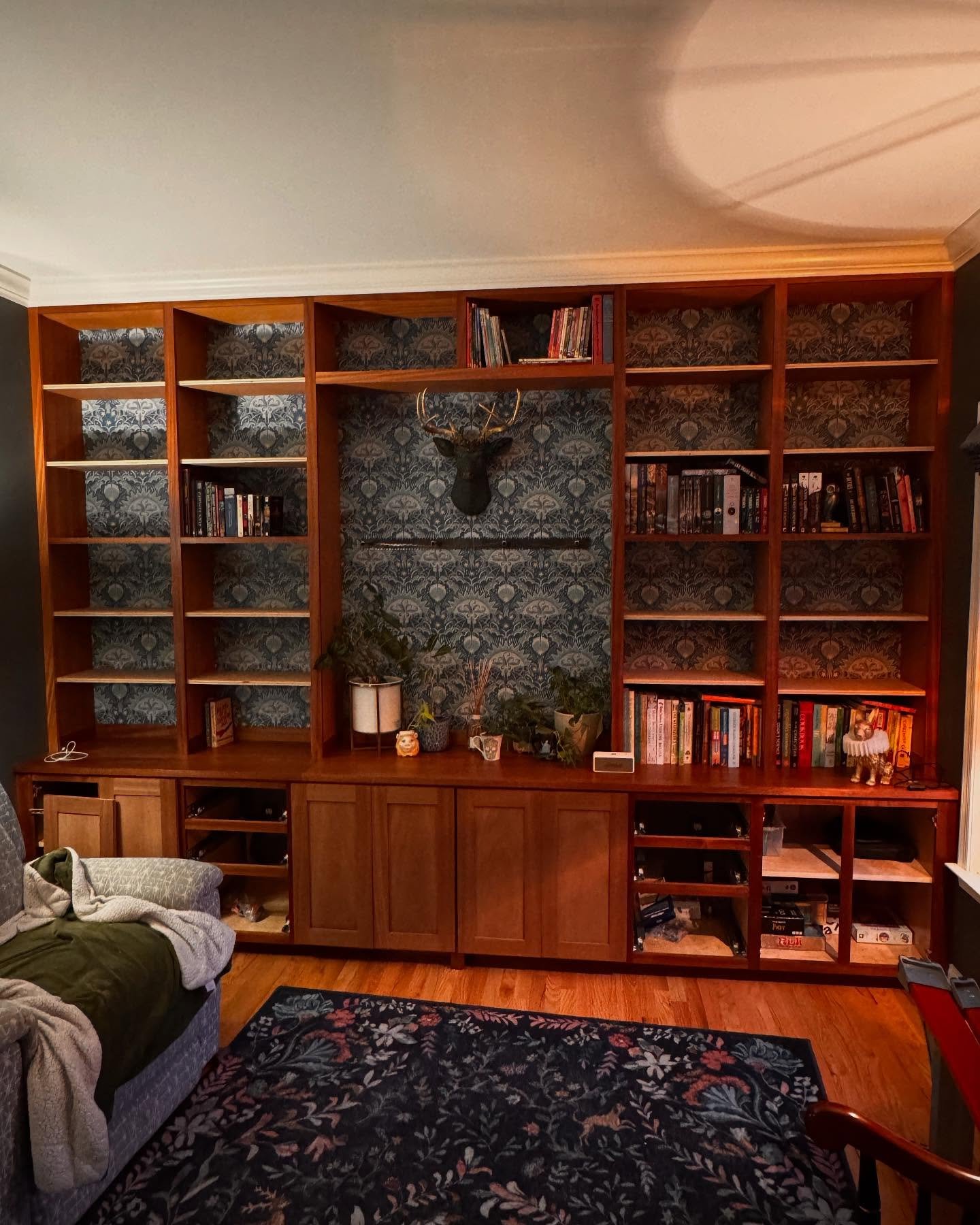 Almost there. Got the crown reinstalled and caulked in, and the mantle is ready to install once the finish dries overnight. All I have left is finishing the doors, making six drawers, and gluing up the trim and finishing the 16 adjustable shelves, an