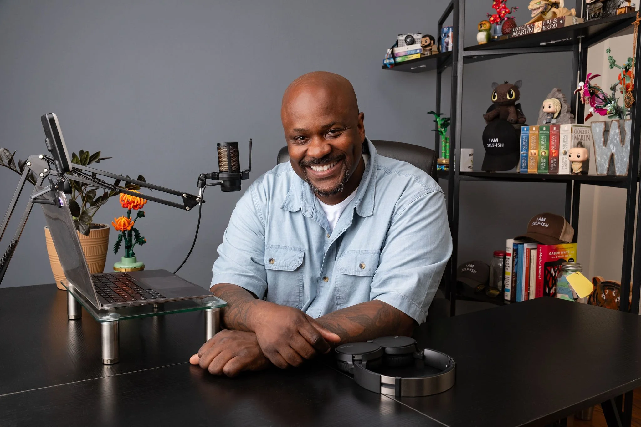 Picture of Will Wright, smiling at his desk in the Bronx