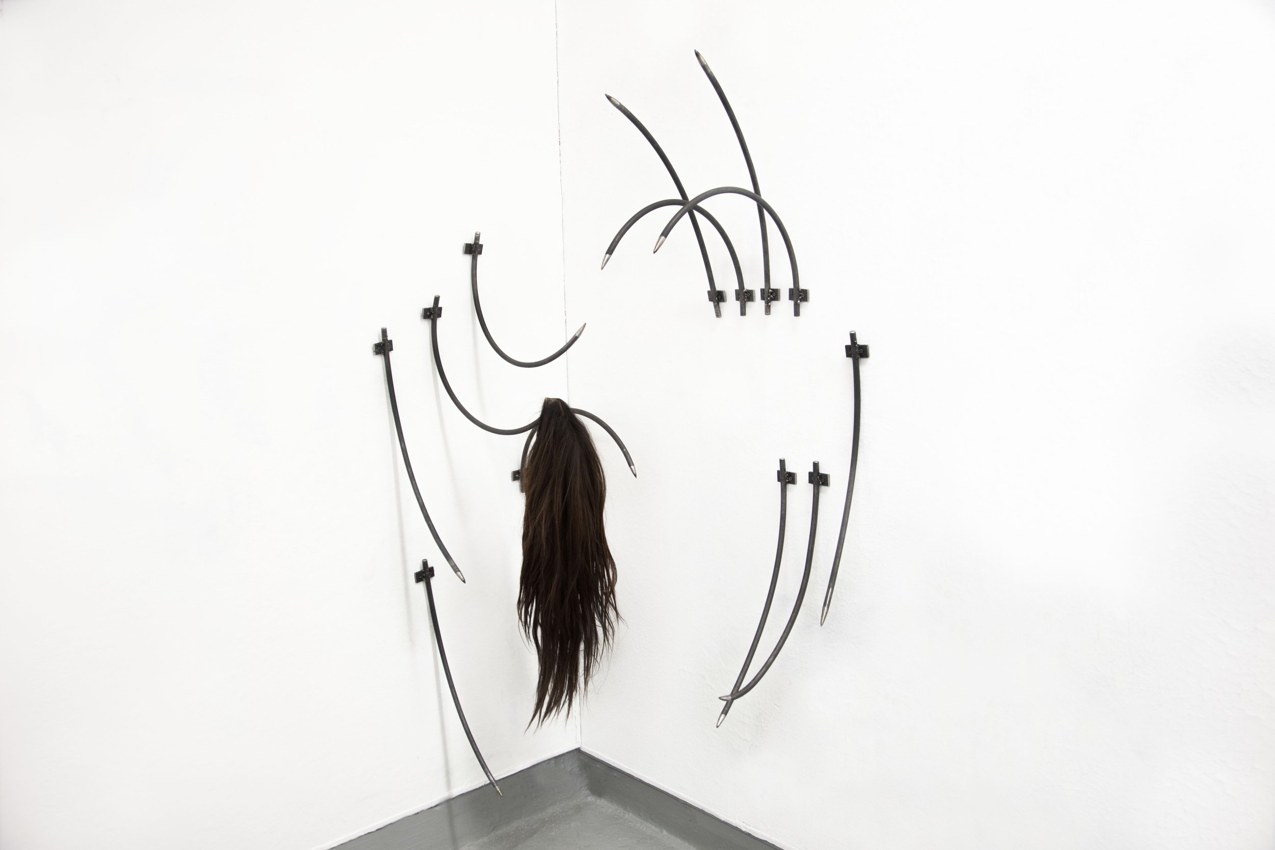 "Inciting Incidents" Series, Metal rods, Synthetic Wig. 2024