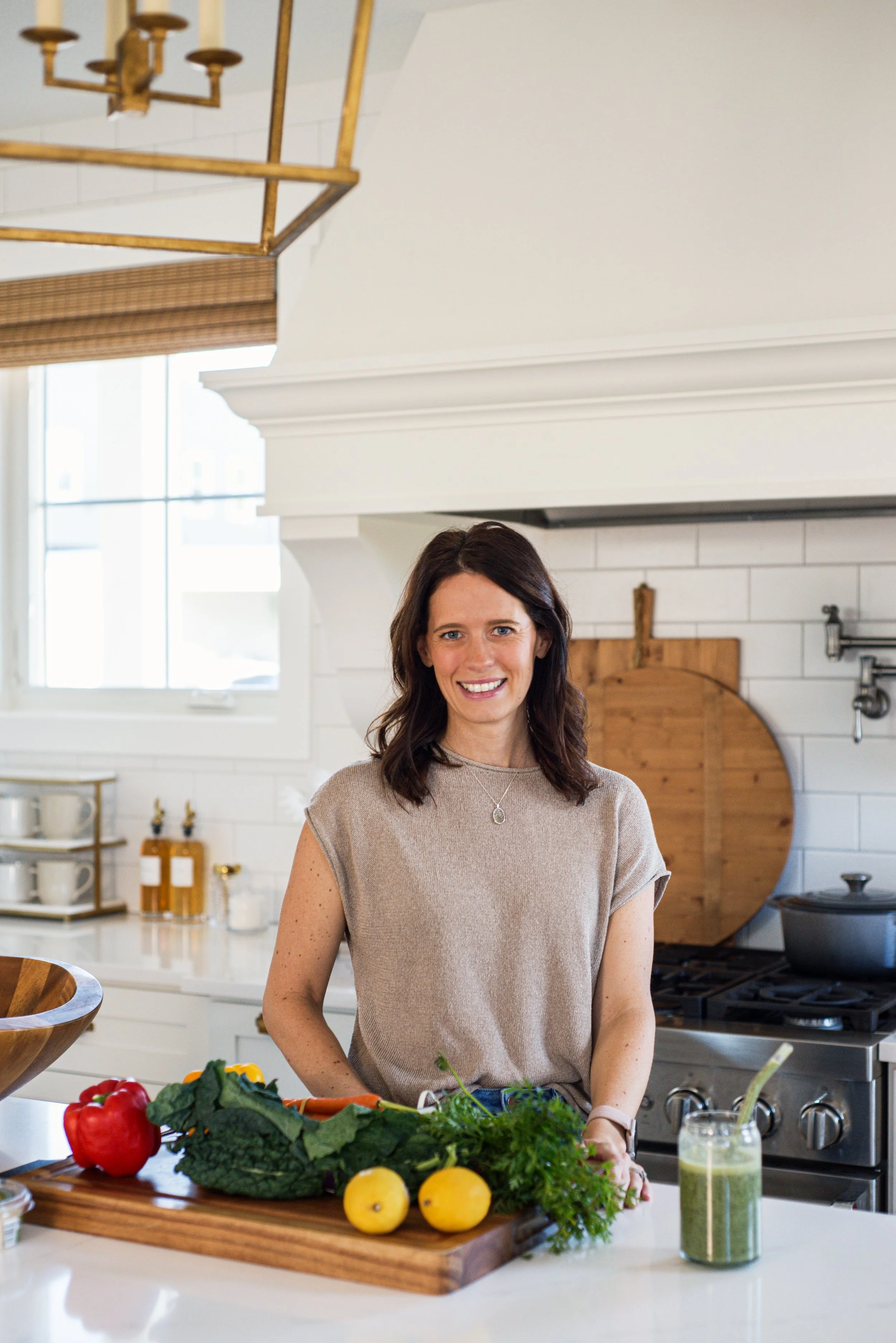 confident woman in kitchen feeling strong, energized, and resilient
