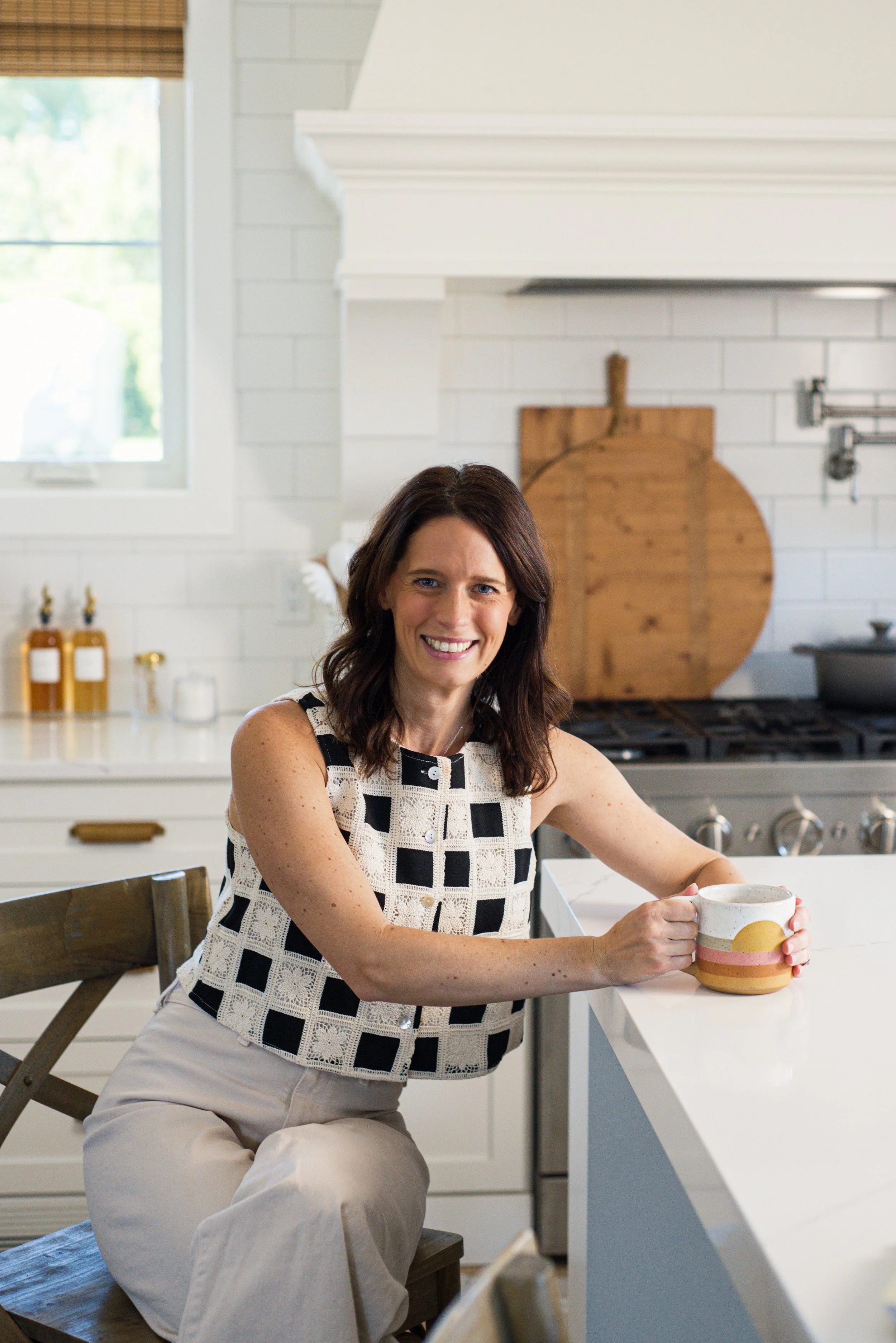 women sitting with cup of tea considering next decades ahead