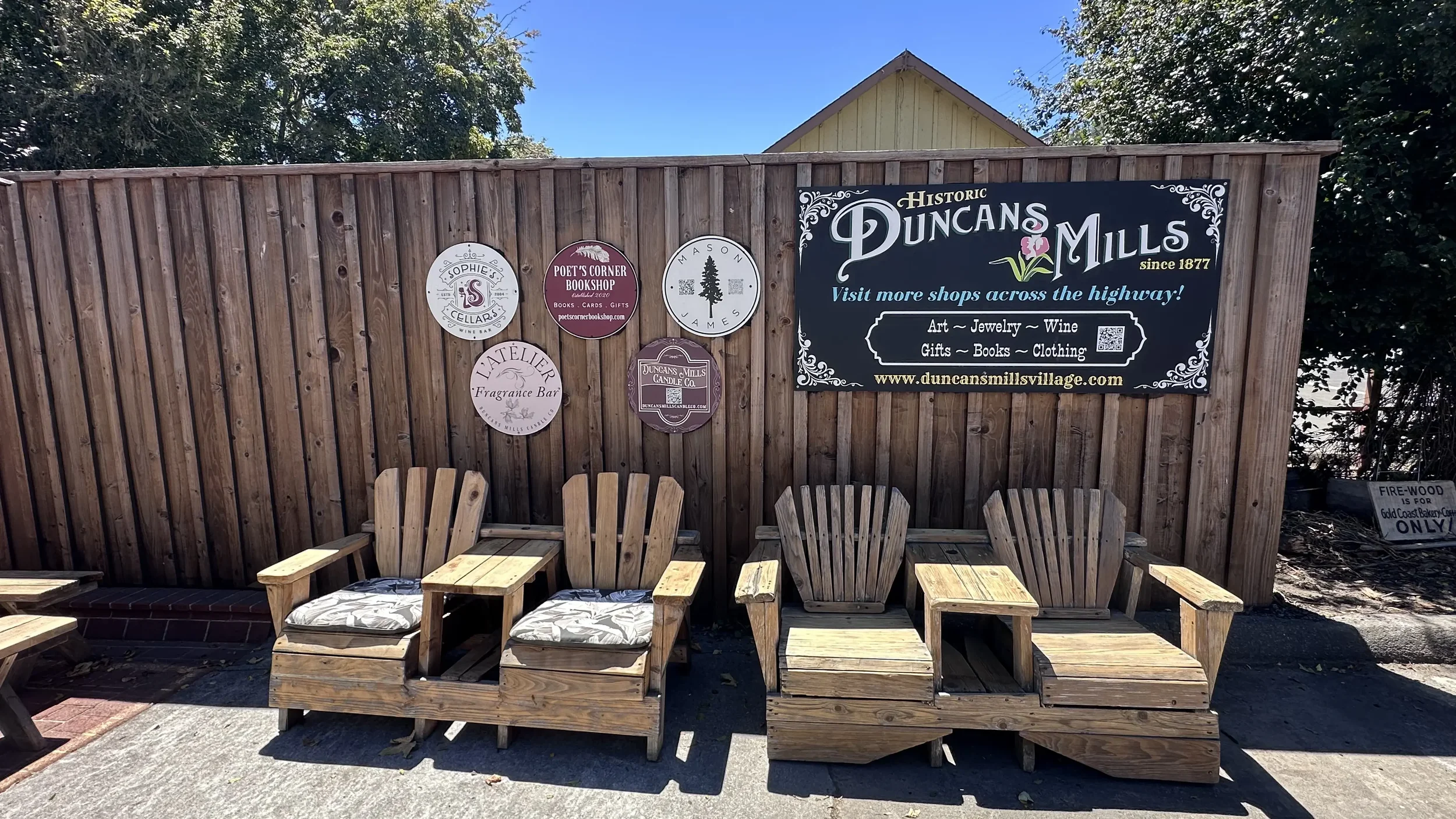 Outdoor seating area with Duncan Mills signage