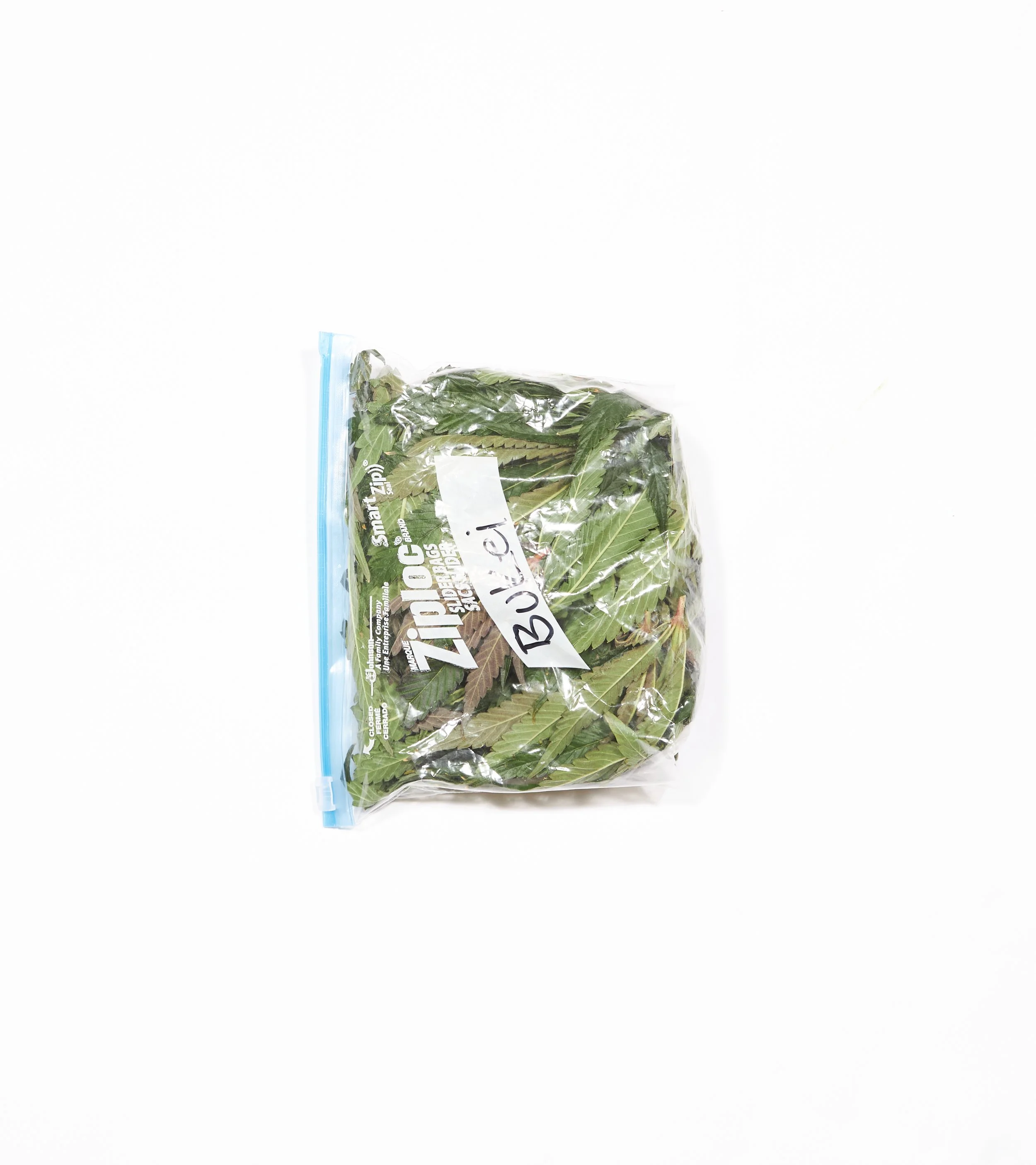 A plastic zip-top bag filled with fresh green herbs labeled "Bulik" on a white background.