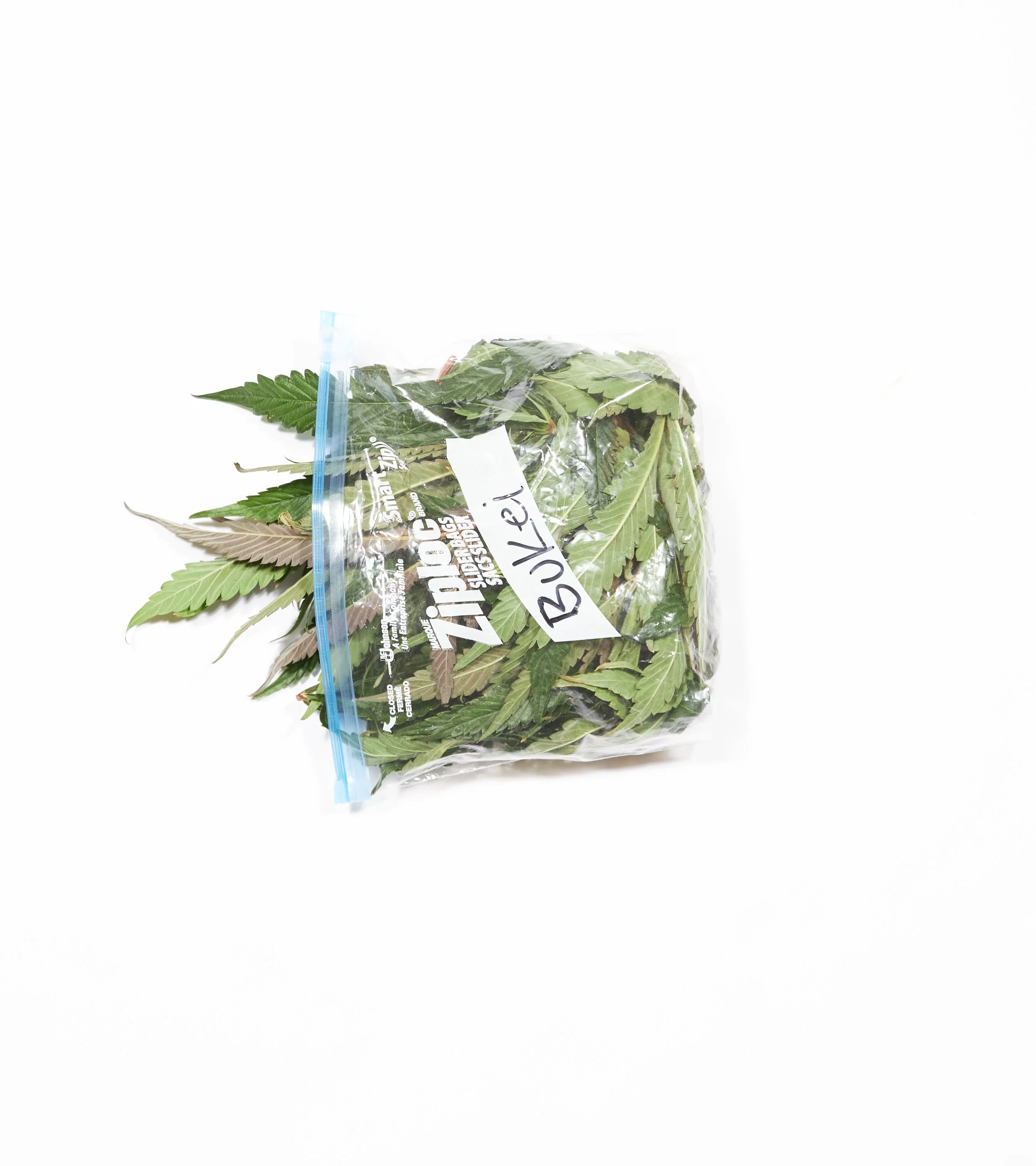 Bag of fresh cannabis leaves labeled 'Bulva' on a white background.