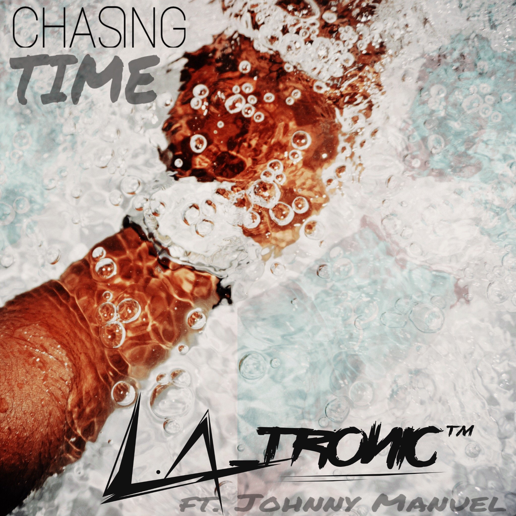 A person submerged in water with bubbles around them, reaching forward, with the text "Chasing Time" and "L.A. Tonic ft. Johnny Manuel" overlaid.