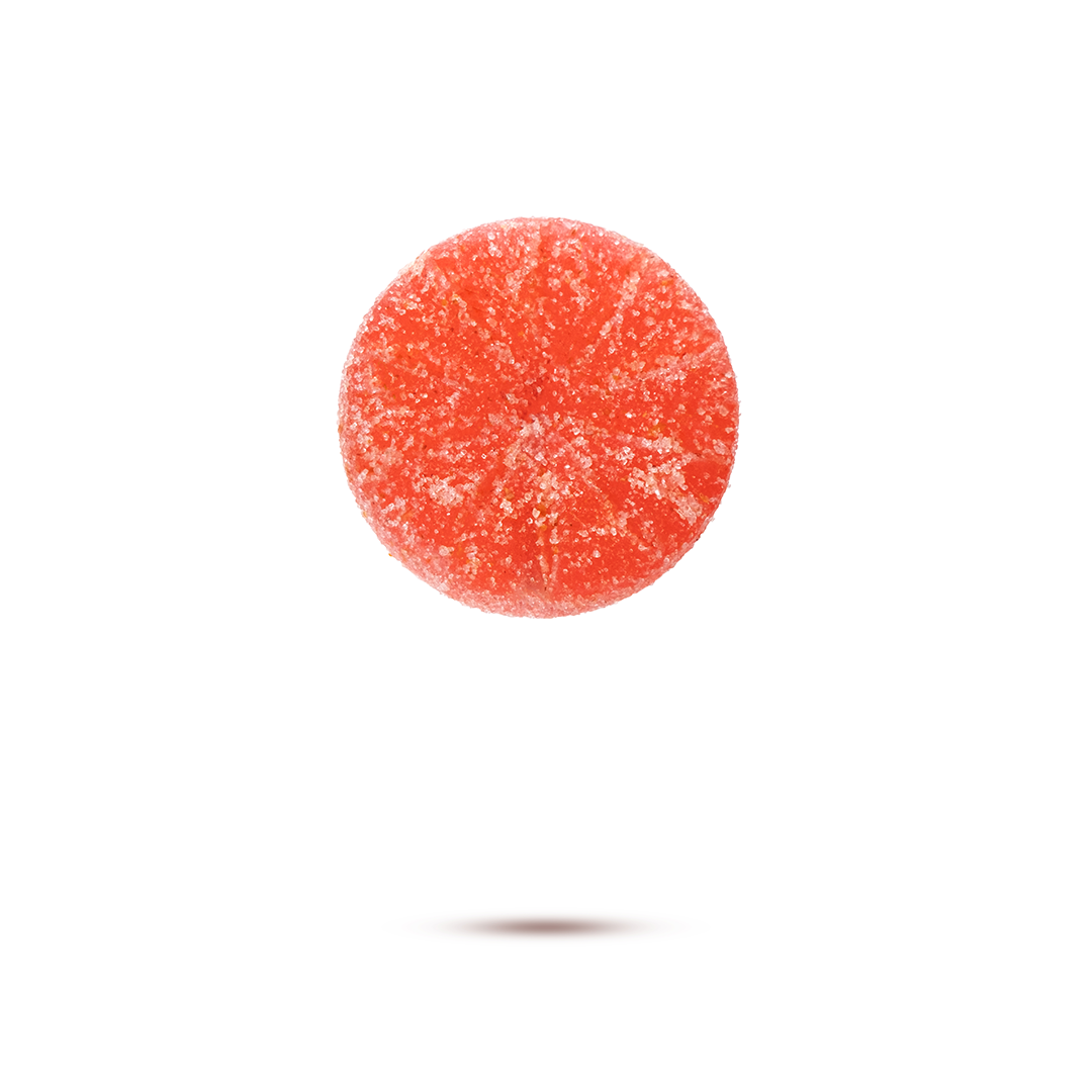 A red gummy candy with sugar coating, floating above a white background.
