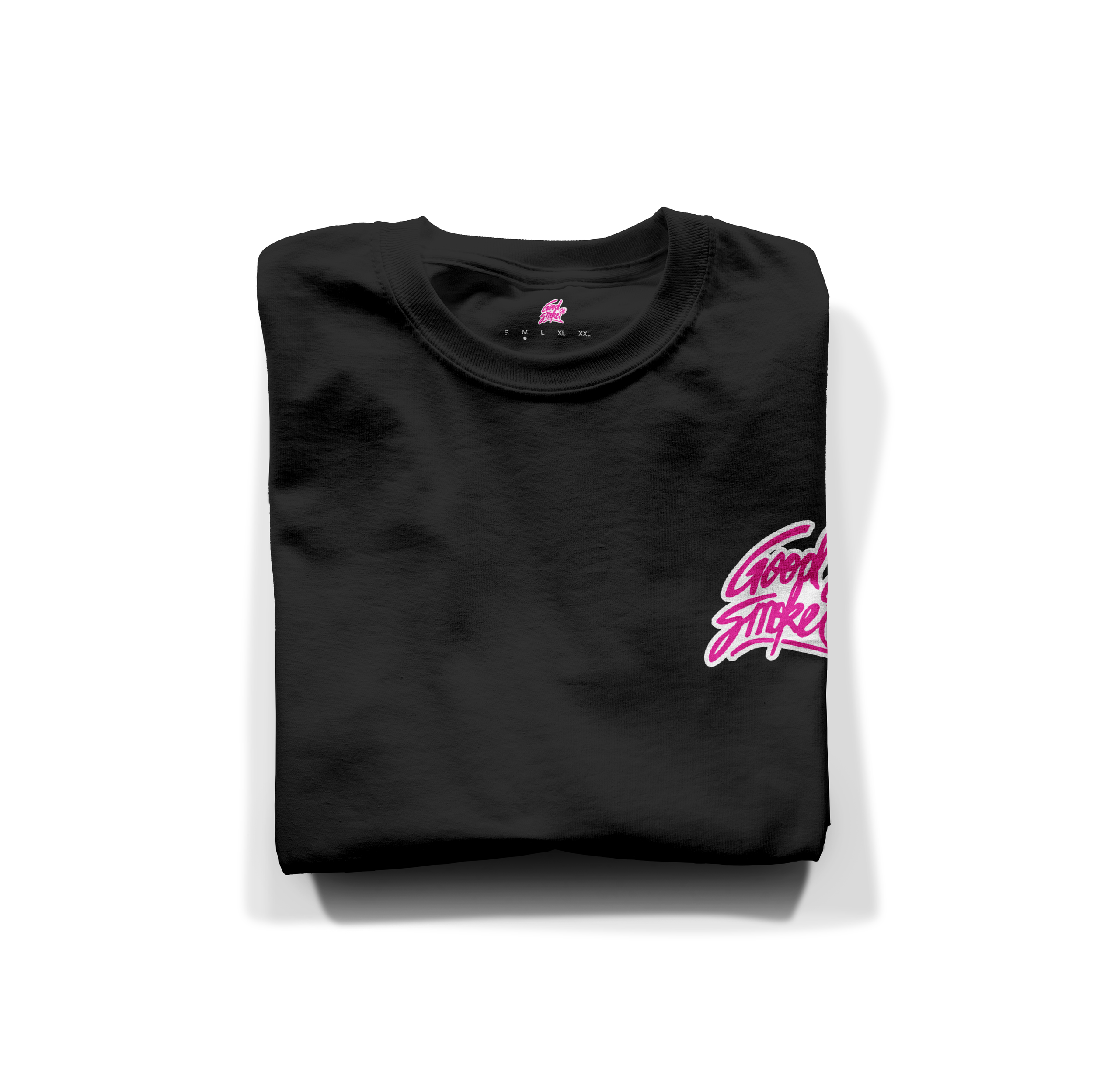 Folded black t-shirt with pink cursive logo on the chest reading 'Good Vibes'