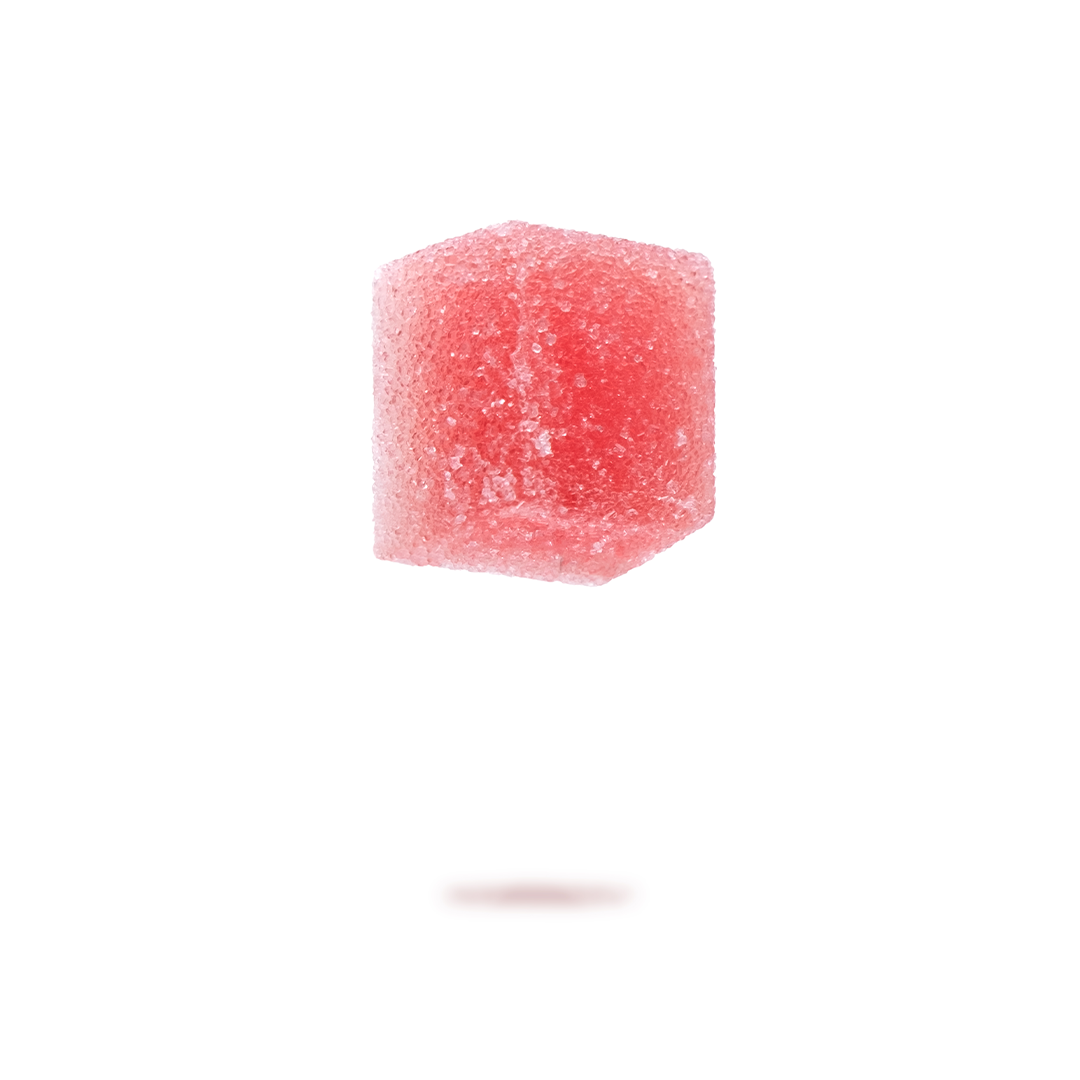 Pink sugar cube floating above a blurred shadow on a white background.