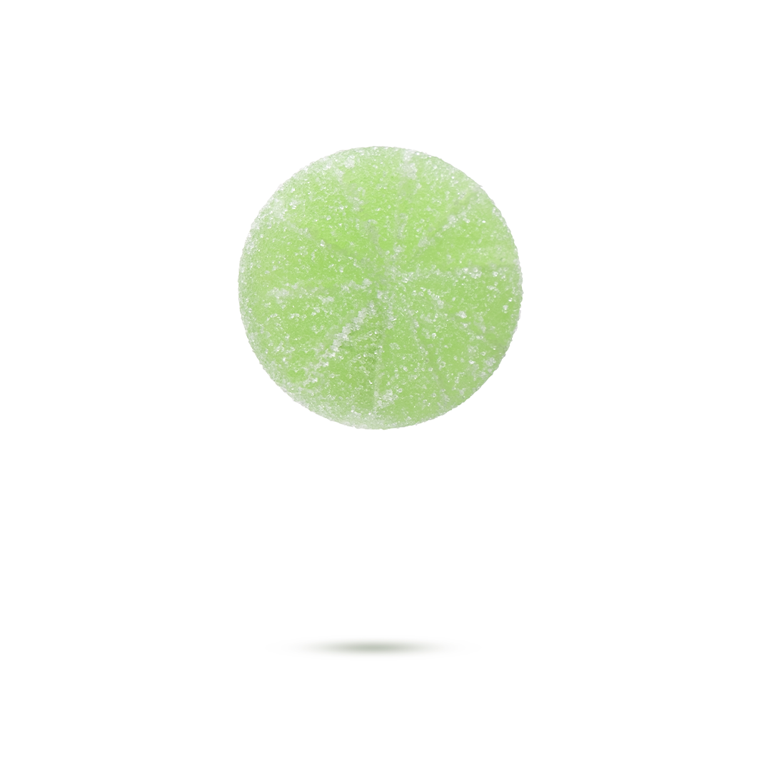 Green, sugar-coated candy with a round shape, cast a small shadow on a white background.
