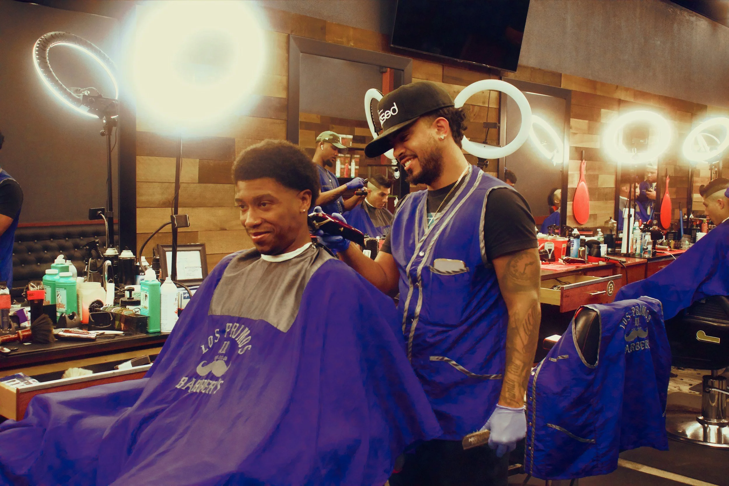 Barber giving client a hair cut